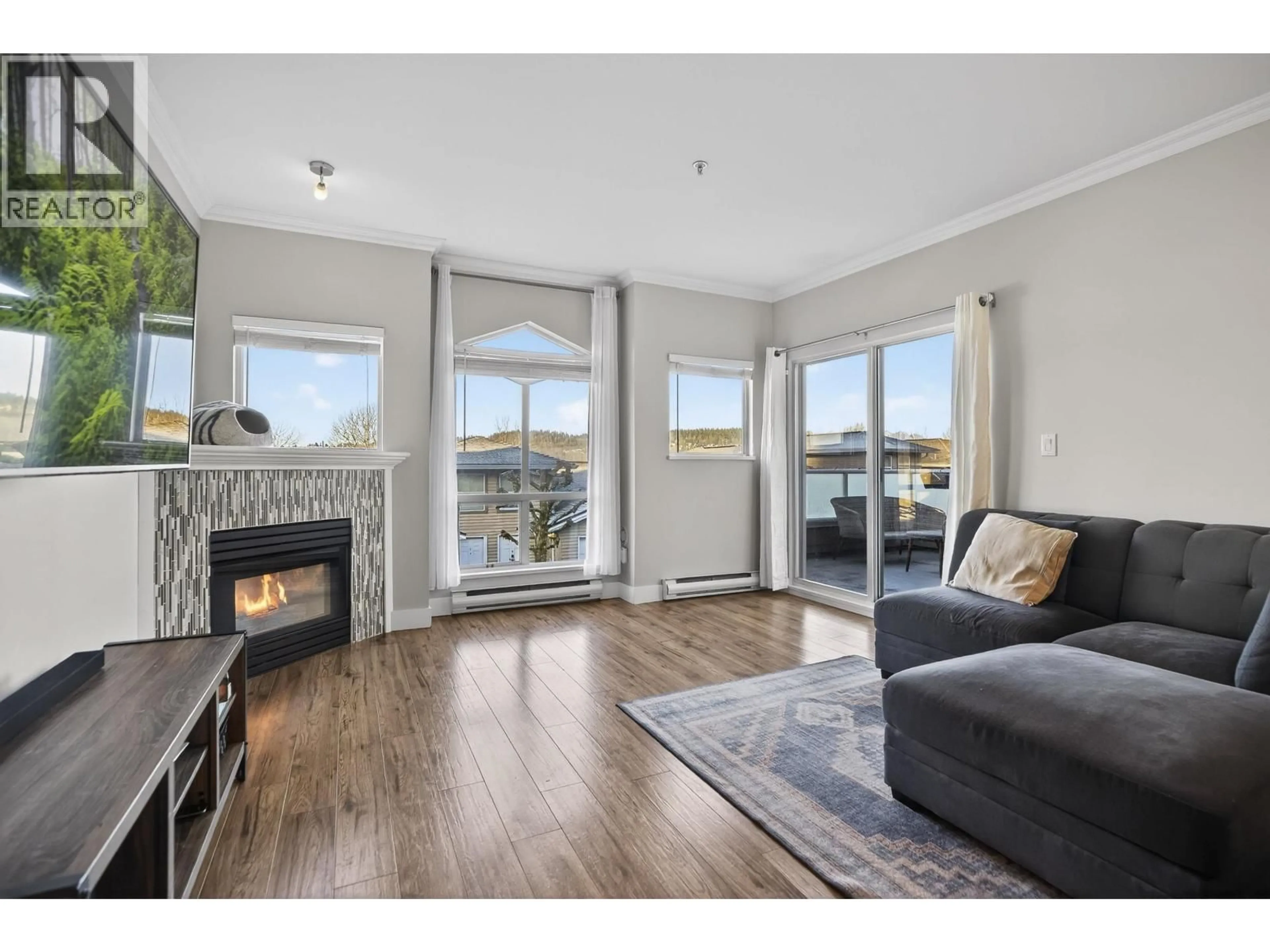 Living room with furniture, wood/laminate floor for 1126 O'FLAHERTY GATE, Port Coquitlam British Columbia V3C6H2