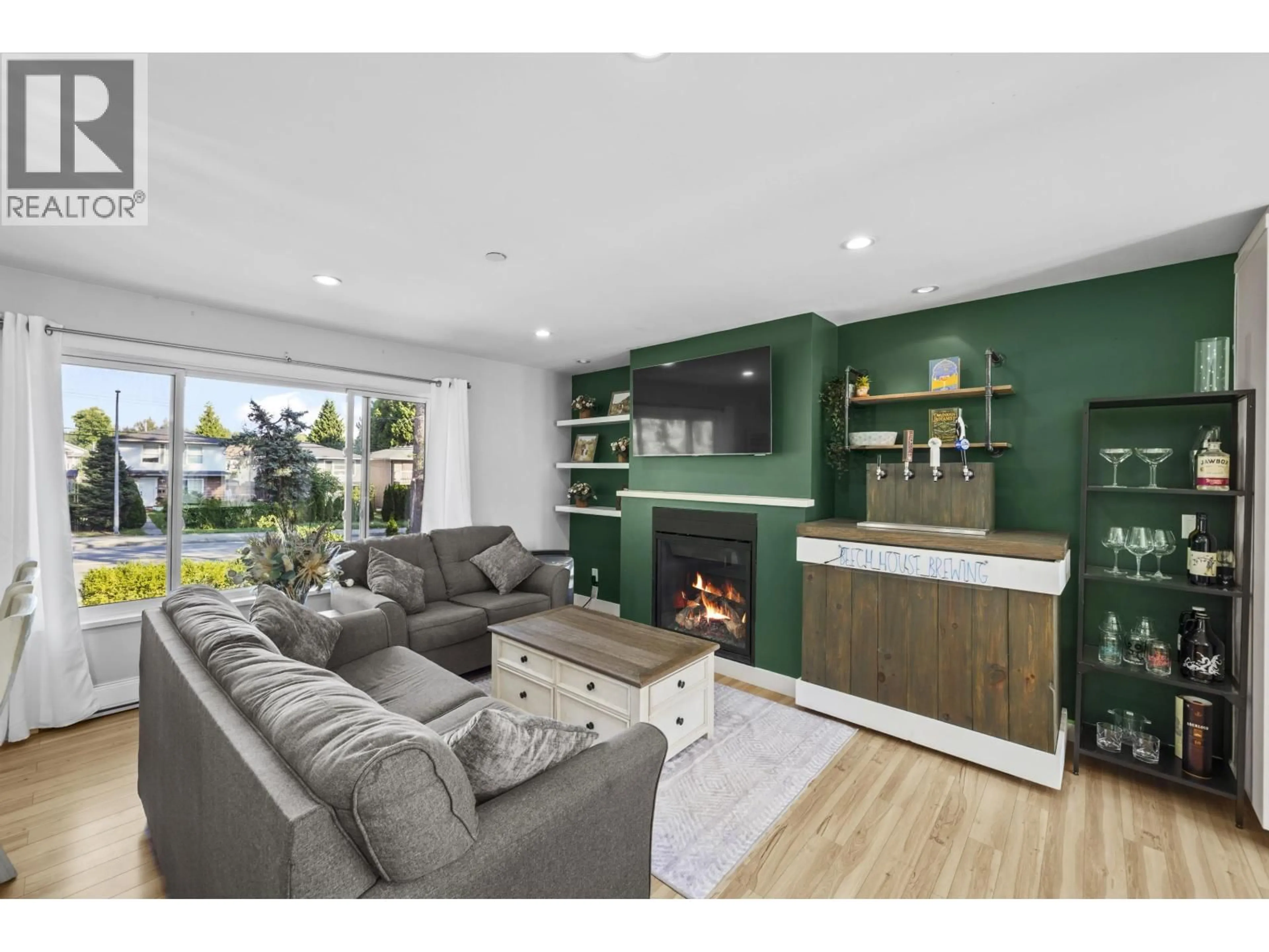 Living room with furniture, wood/laminate floor for 3759 COAST MERIDIAN ROAD, Port Coquitlam British Columbia V3B3P2