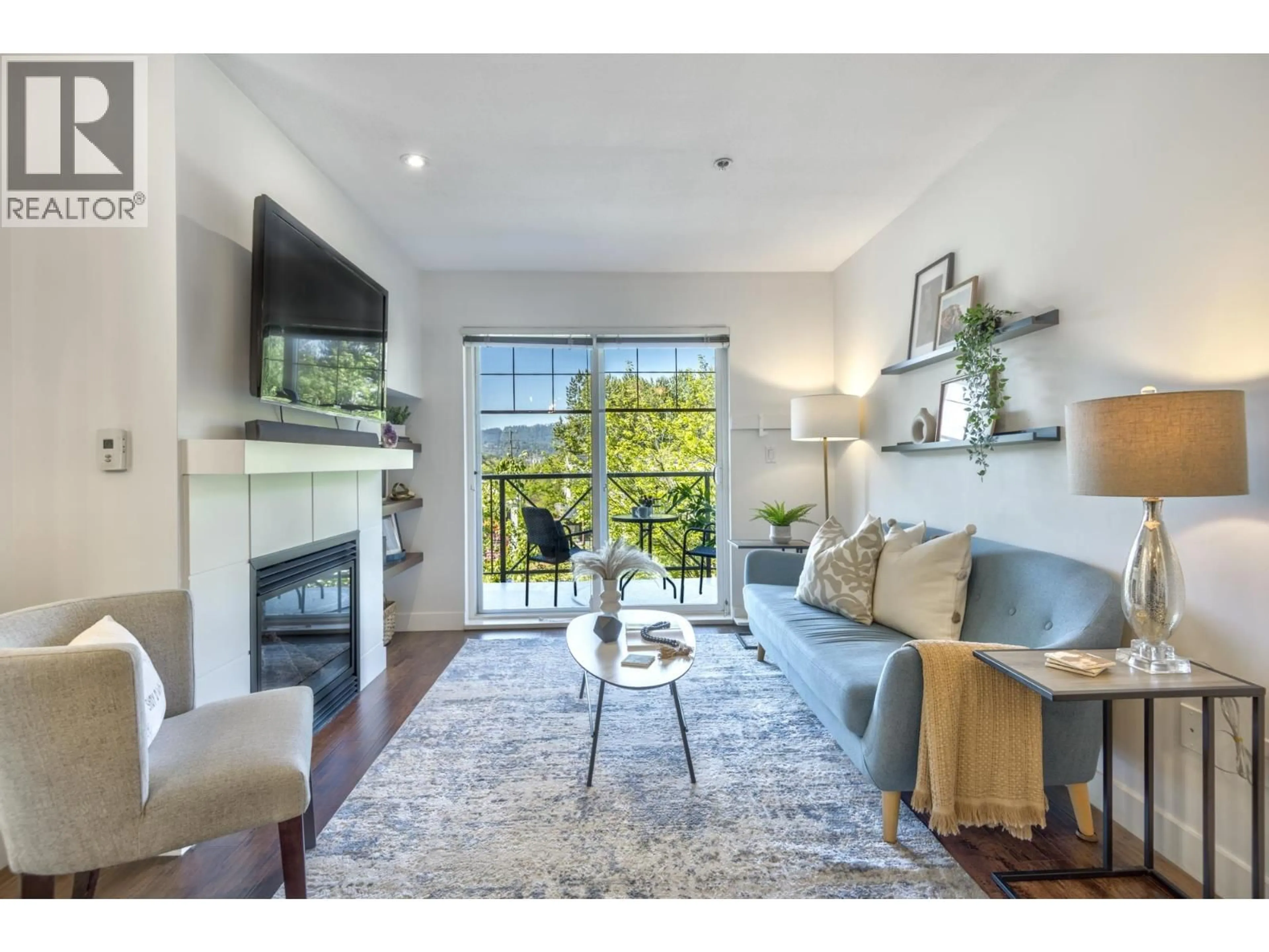 Living room with furniture, wood/laminate floor for 302 - 3240 ST JOHNS STREET, Port Moody British Columbia V3H0C1