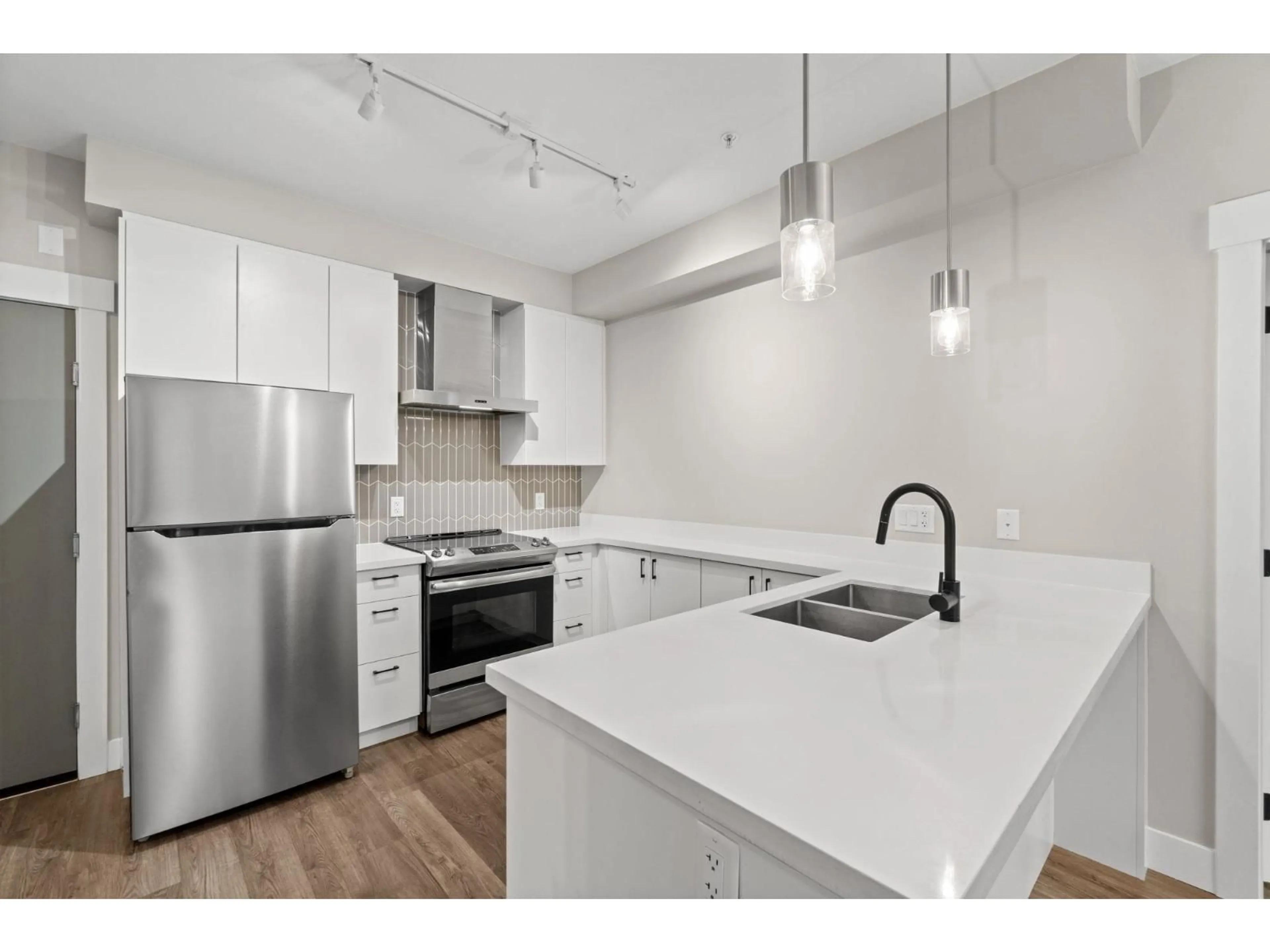 Open concept kitchen, unknown for A101 - 20838 78B AVENUE, Langley British Columbia V2Y3M1