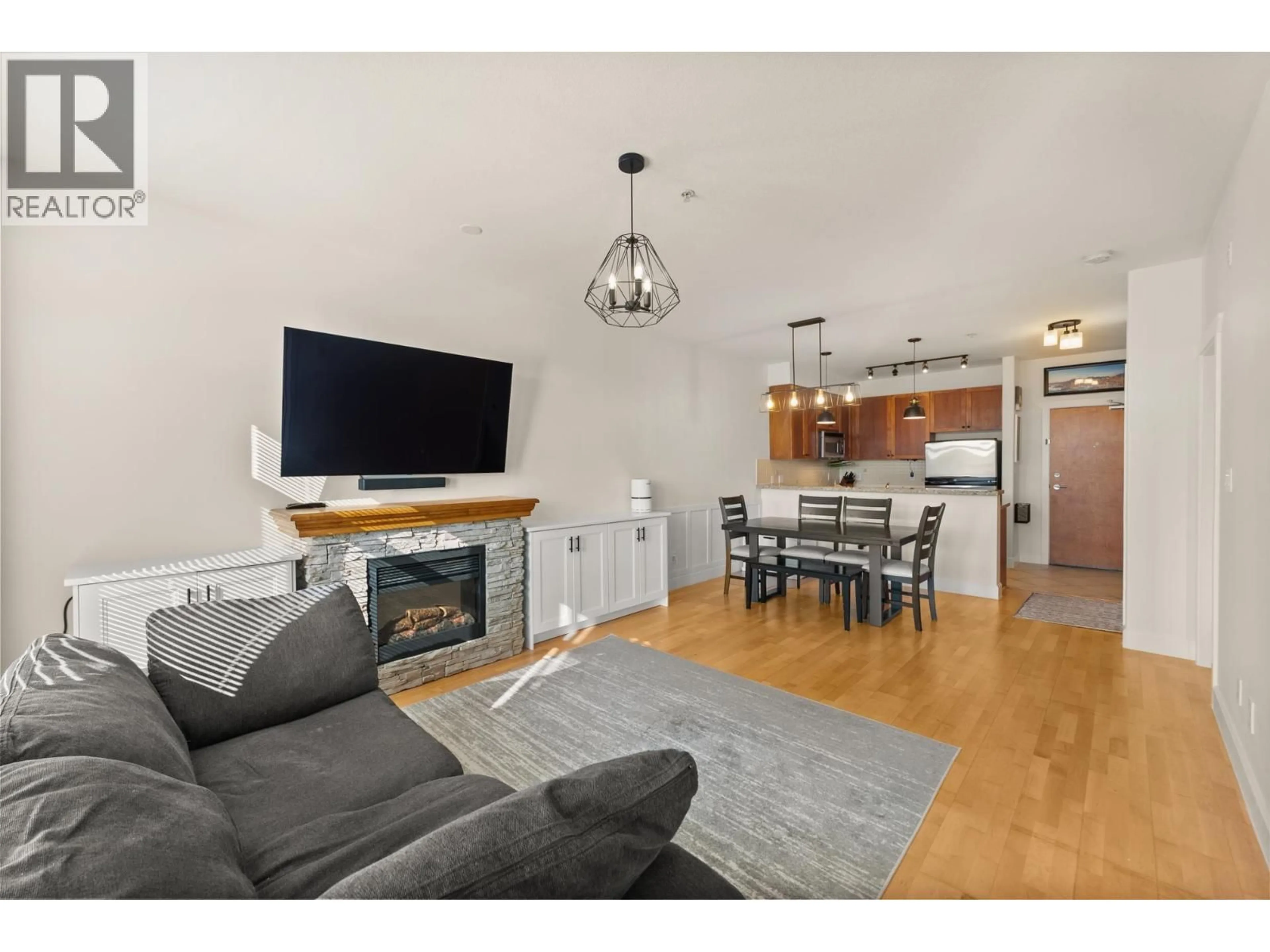 Living room with furniture, wood/laminate floor for 311 - 4280 MONCTON STREET, Richmond British Columbia V7E6T4