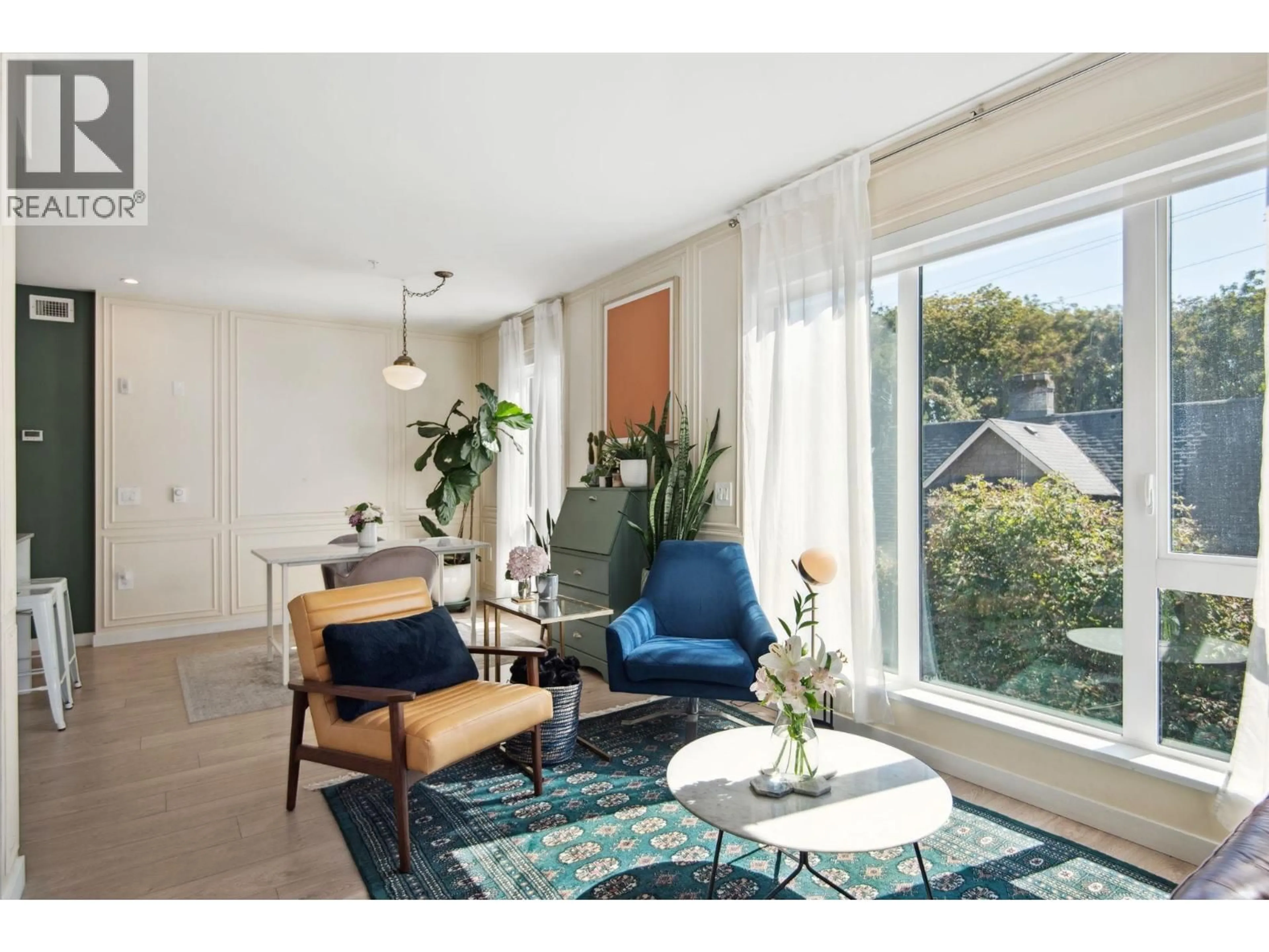 Living room with furniture, wood/laminate floor for 321 - 2520 GUELPH STREET, Vancouver British Columbia V5T0K7