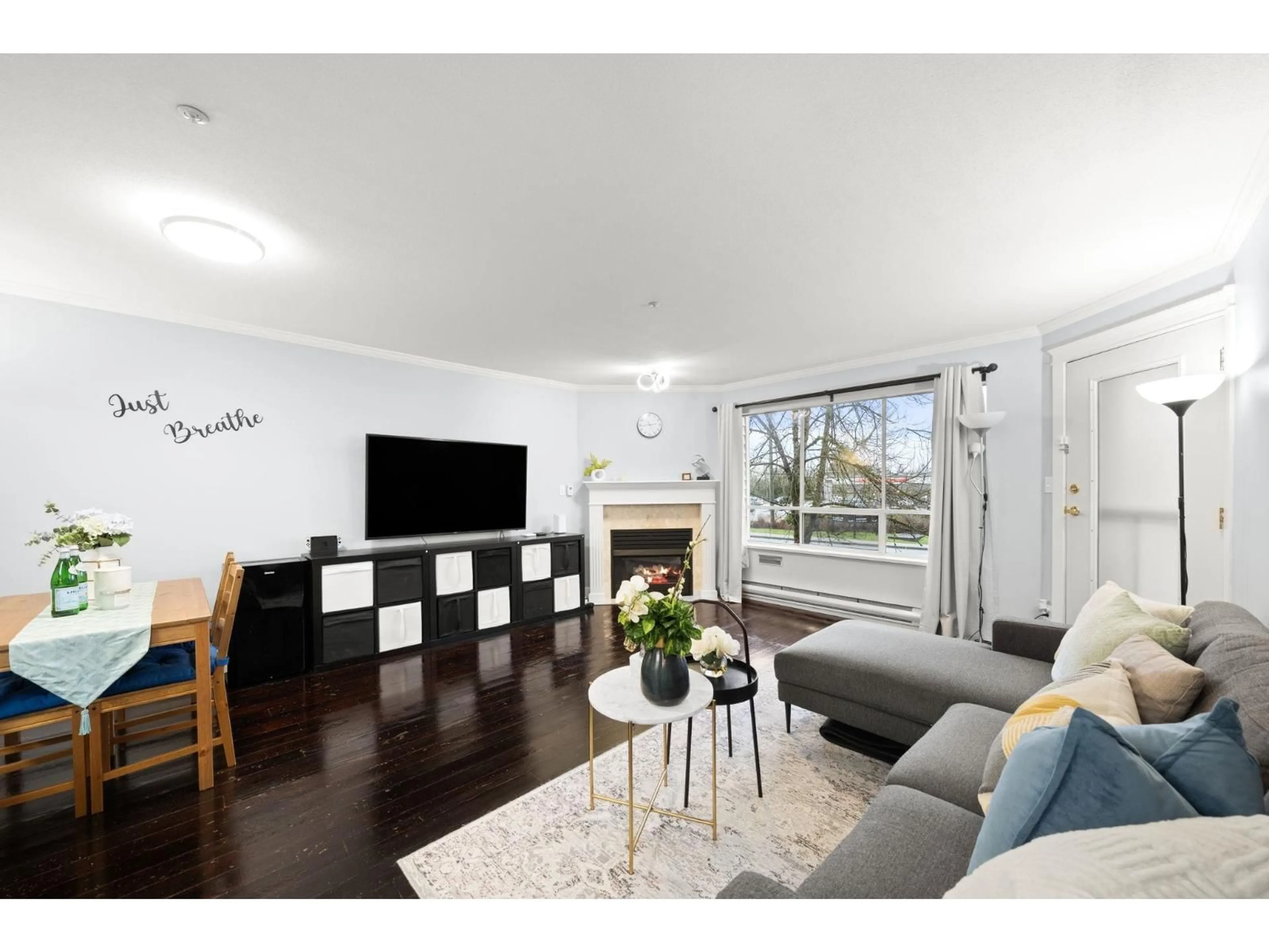 Living room with furniture, wood/laminate floor for 105 - 5450 208 STREET, Langley British Columbia V3A2J9