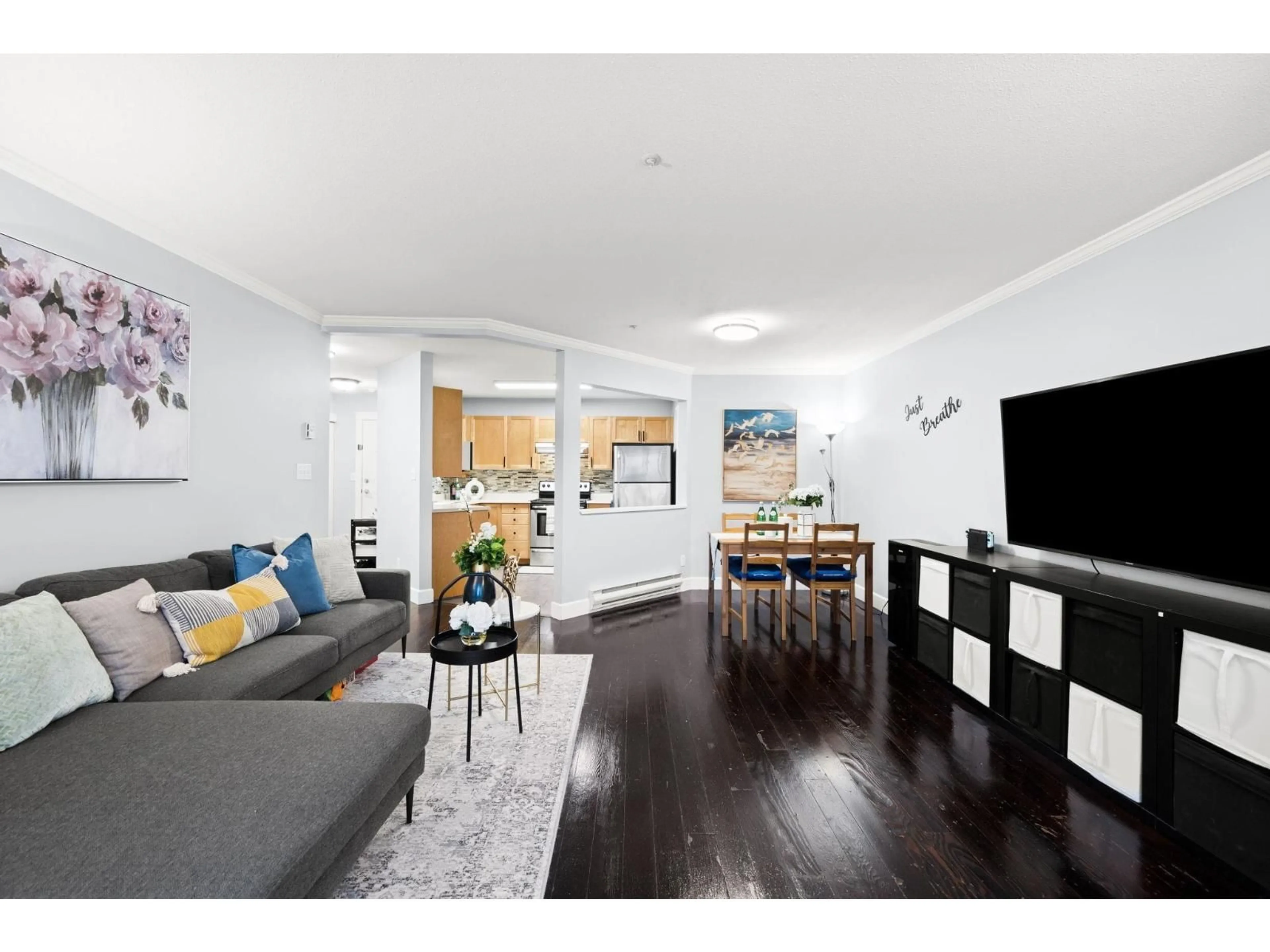 Living room with furniture, wood/laminate floor for 105 - 5450 208 STREET, Langley British Columbia V3A2J9