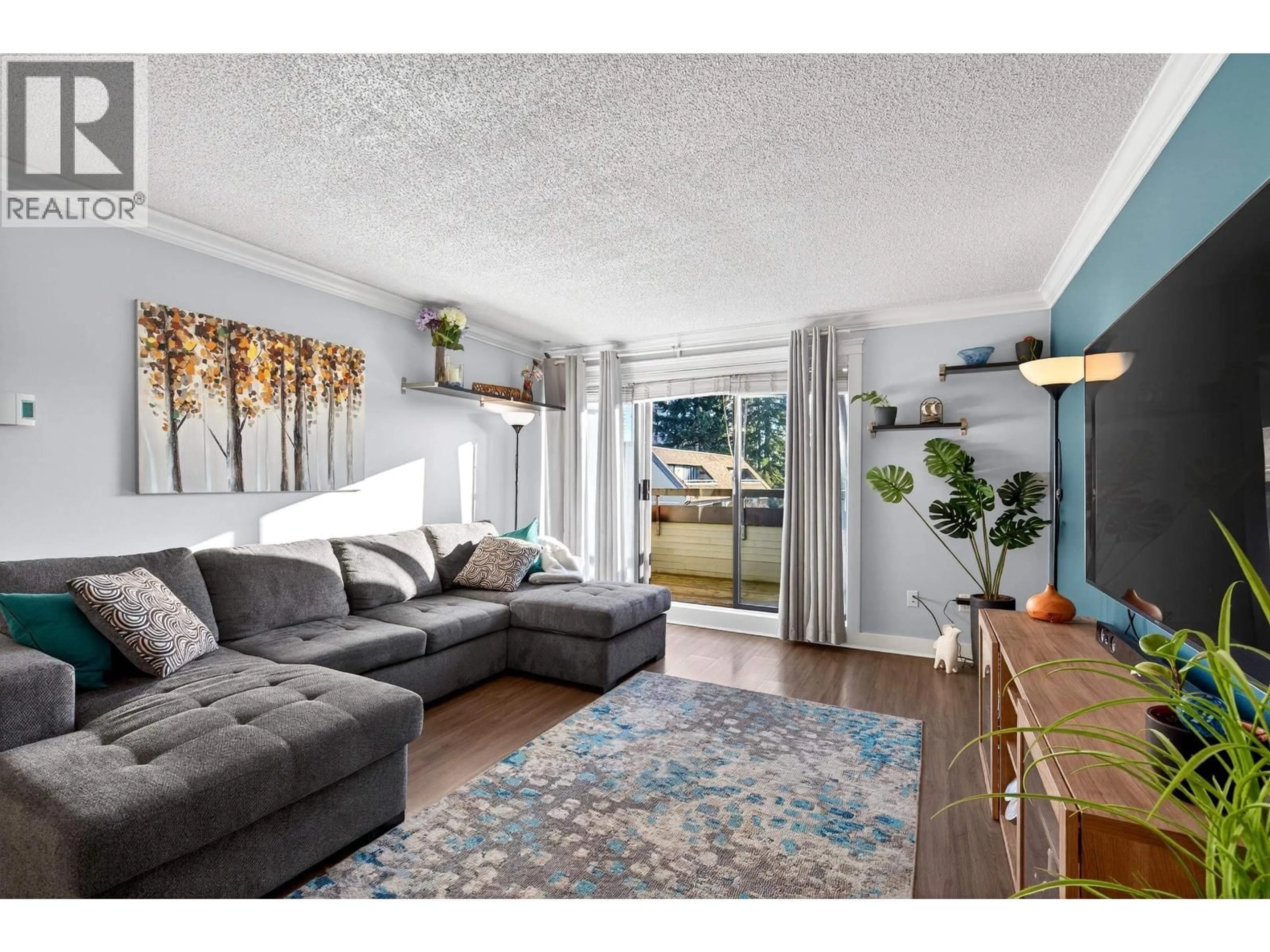 Living room with furniture, wood/laminate floor for 402 - 1210 PACIFIC STREET, Coquitlam British Columbia V3B6K3