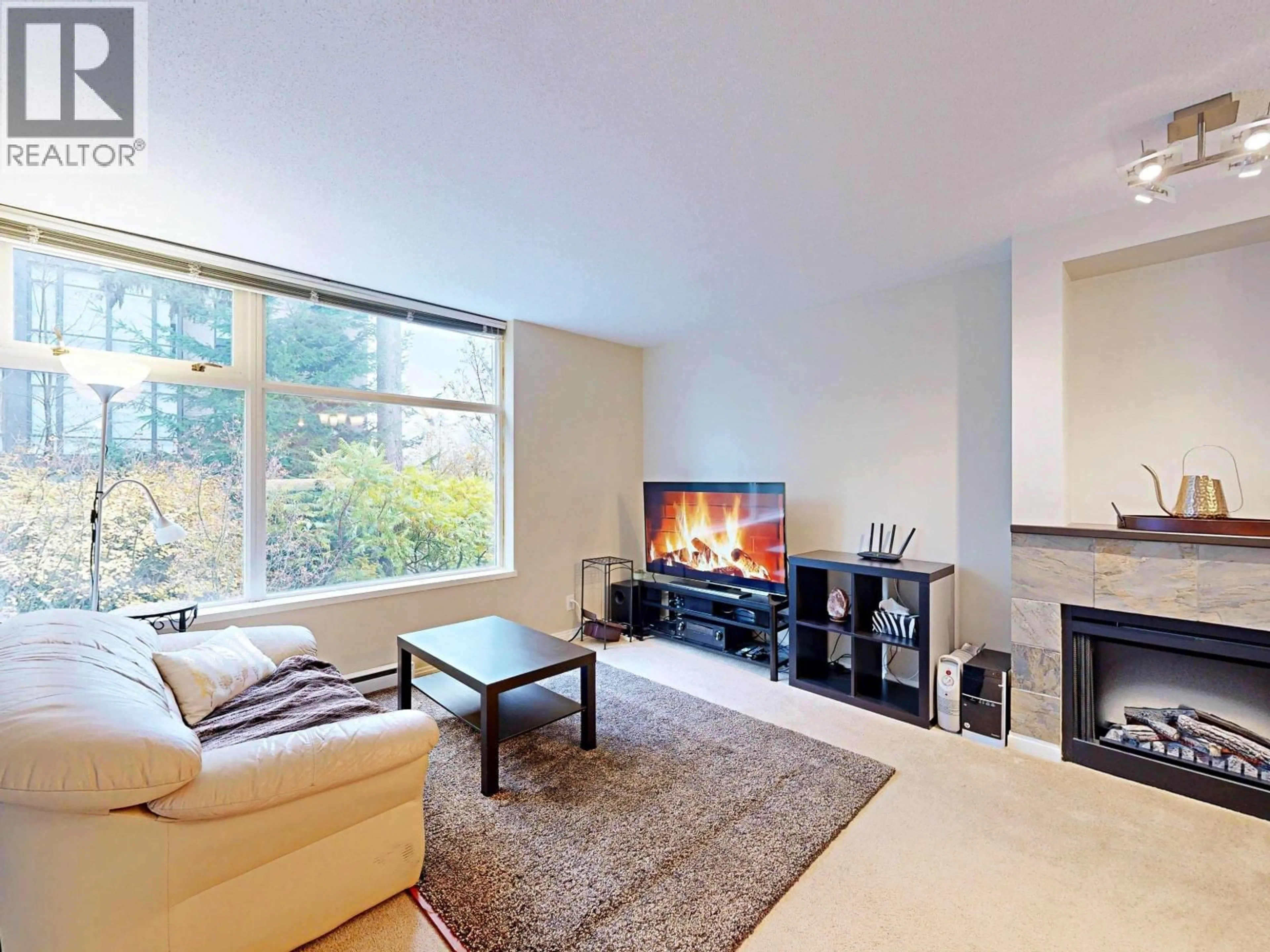 Living room with furniture, unknown for 101 - 9298 UNIVERSITY CRESCENT, Burnaby British Columbia V5A4X8