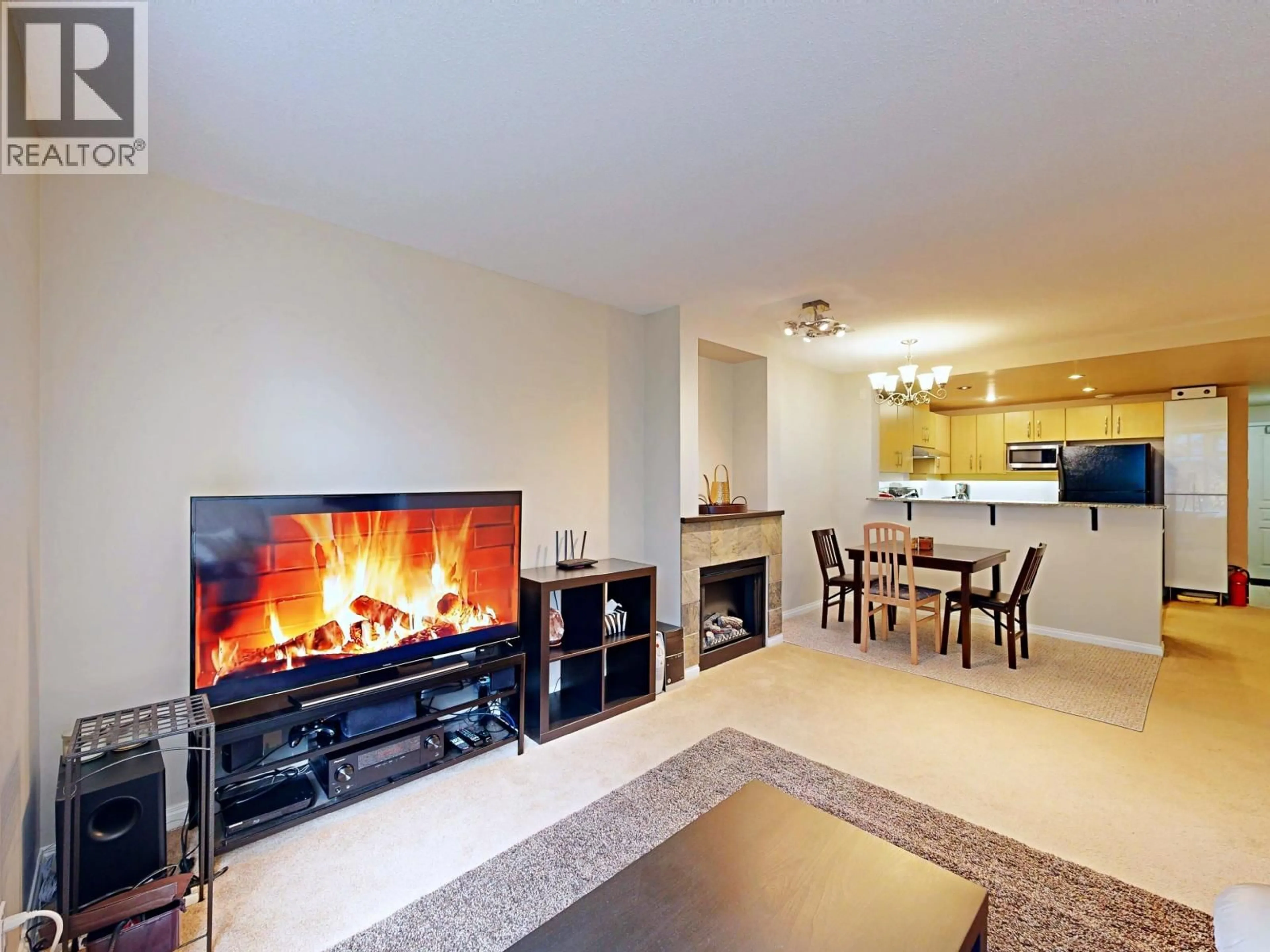 Living room with furniture, unknown for 101 - 9298 UNIVERSITY CRESCENT, Burnaby British Columbia V5A4X8