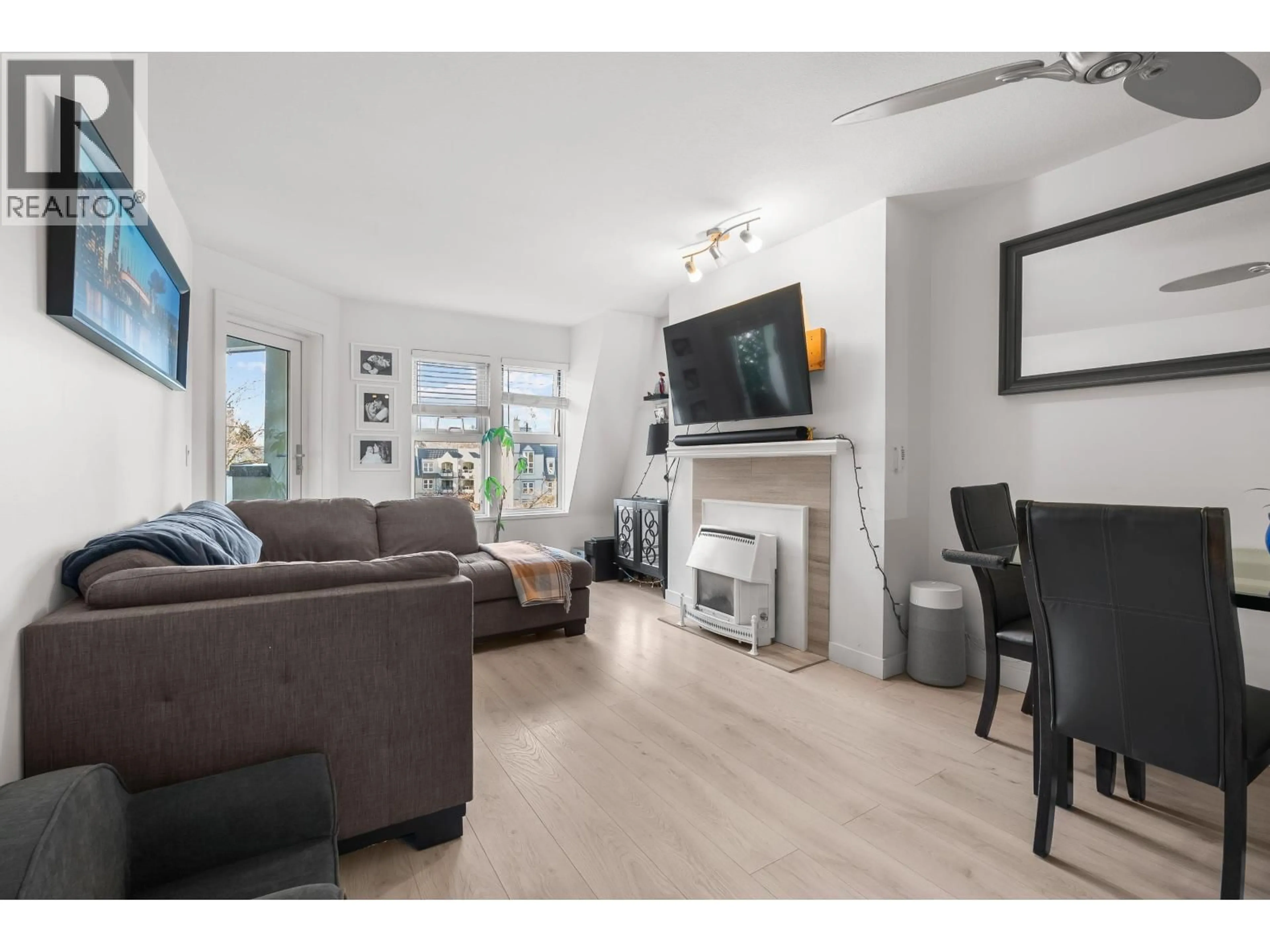 Living room with furniture, wood/laminate floor for 322 - 98 LAVAL STREET, Coquitlam British Columbia V3K6S9