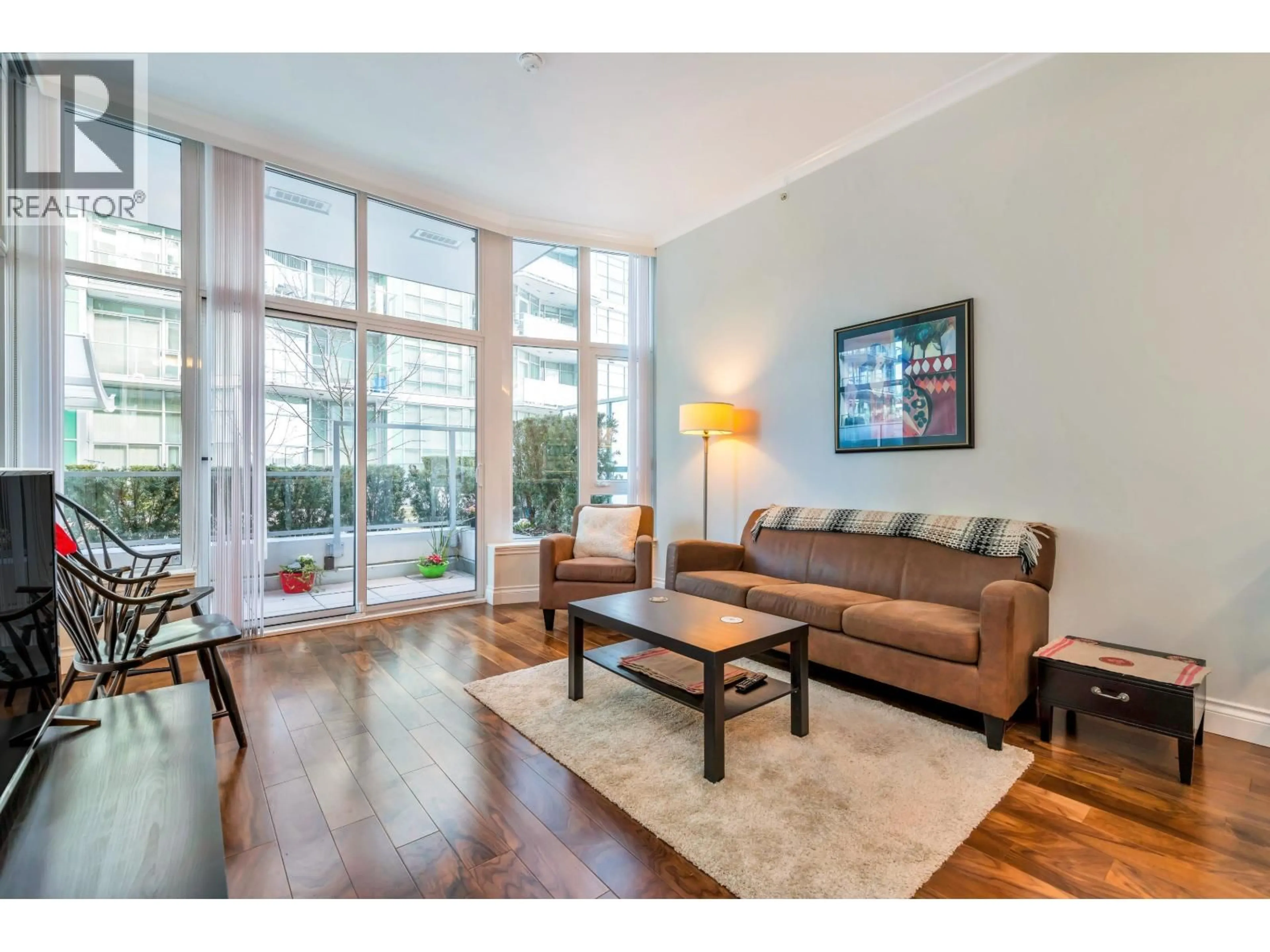 Living room with furniture, unknown for 103 - 185 VICTORY SHIP WAY, North Vancouver British Columbia V7L0G2