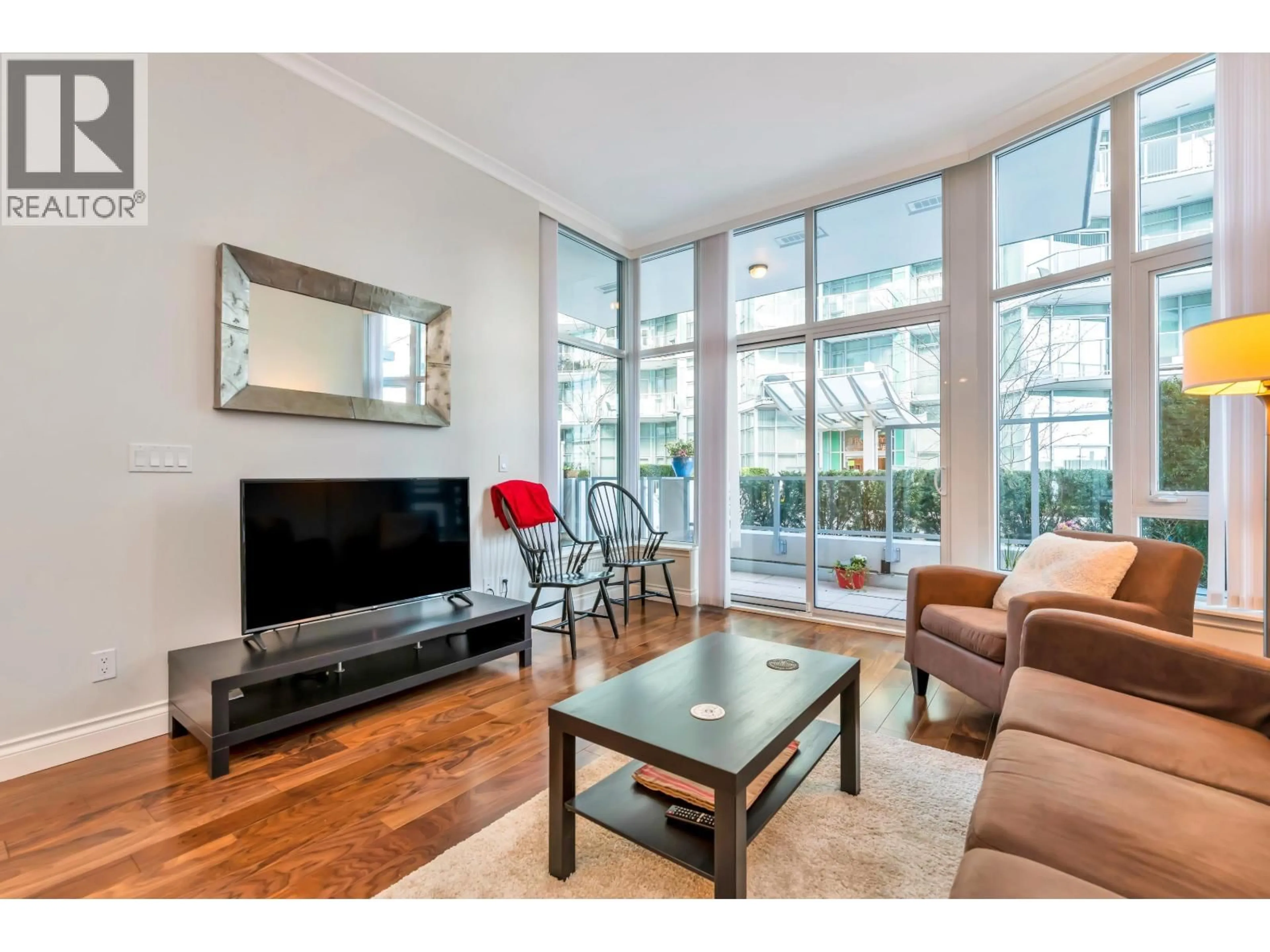 Living room with furniture, unknown for 103 - 185 VICTORY SHIP WAY, North Vancouver British Columbia V7L0G2