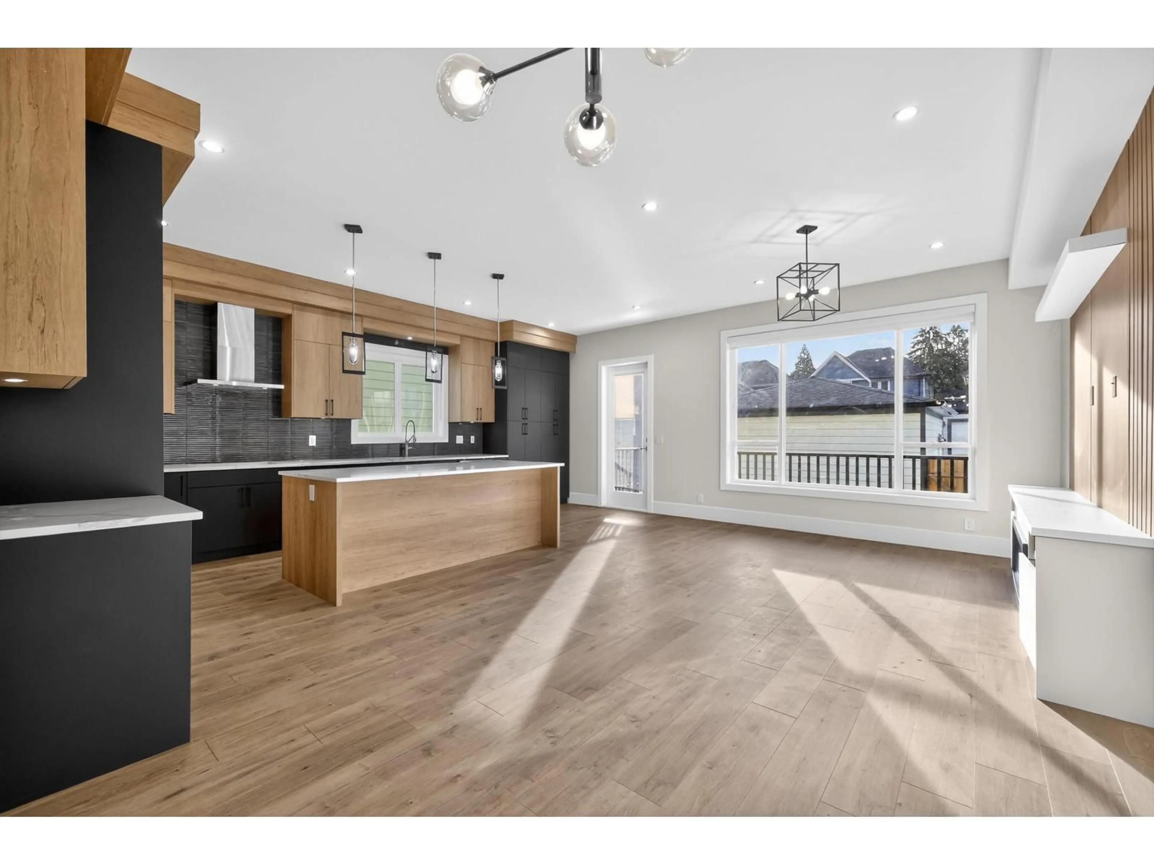 Open concept kitchen, wood/laminate floor for 17126 1 AVENUE, Surrey British Columbia V3Z9R2