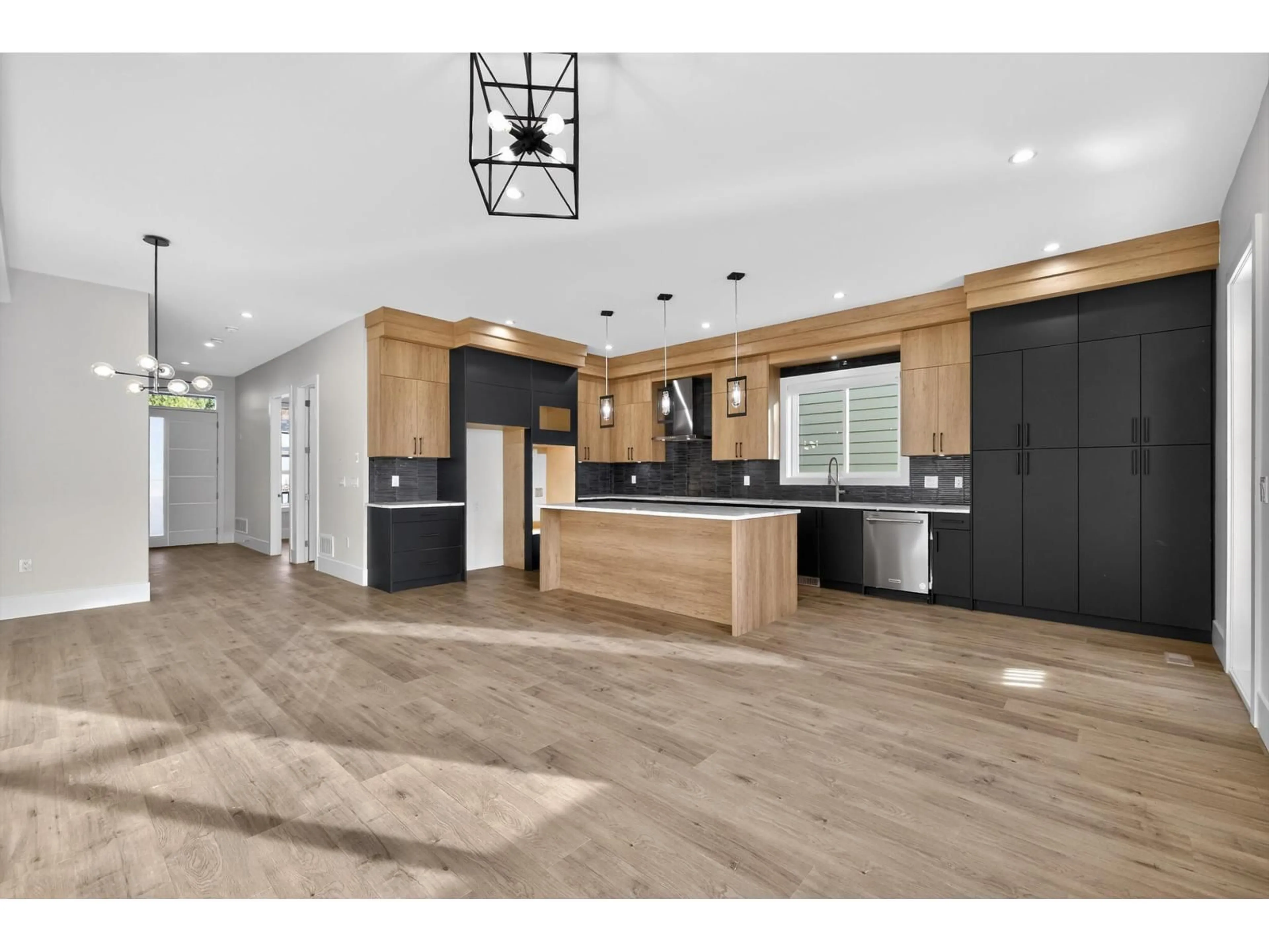 Open concept kitchen, wood/laminate floor for 17126 1 AVENUE, Surrey British Columbia V3Z9R2