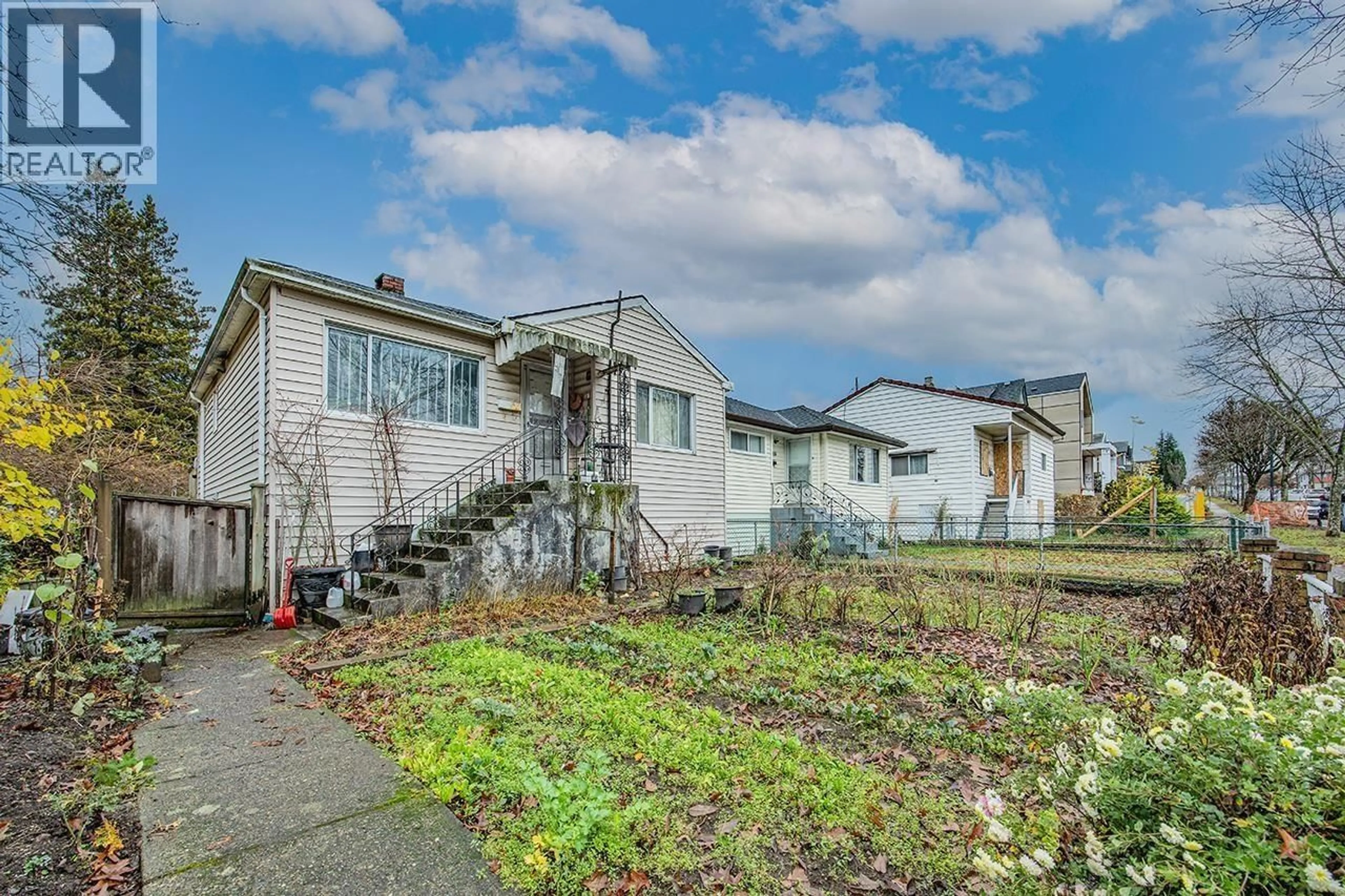 A pic from outside/outdoor area/front of a property/back of a property/a pic from drone, street for 1805 51ST AVENUE, Vancouver British Columbia V5P1W1