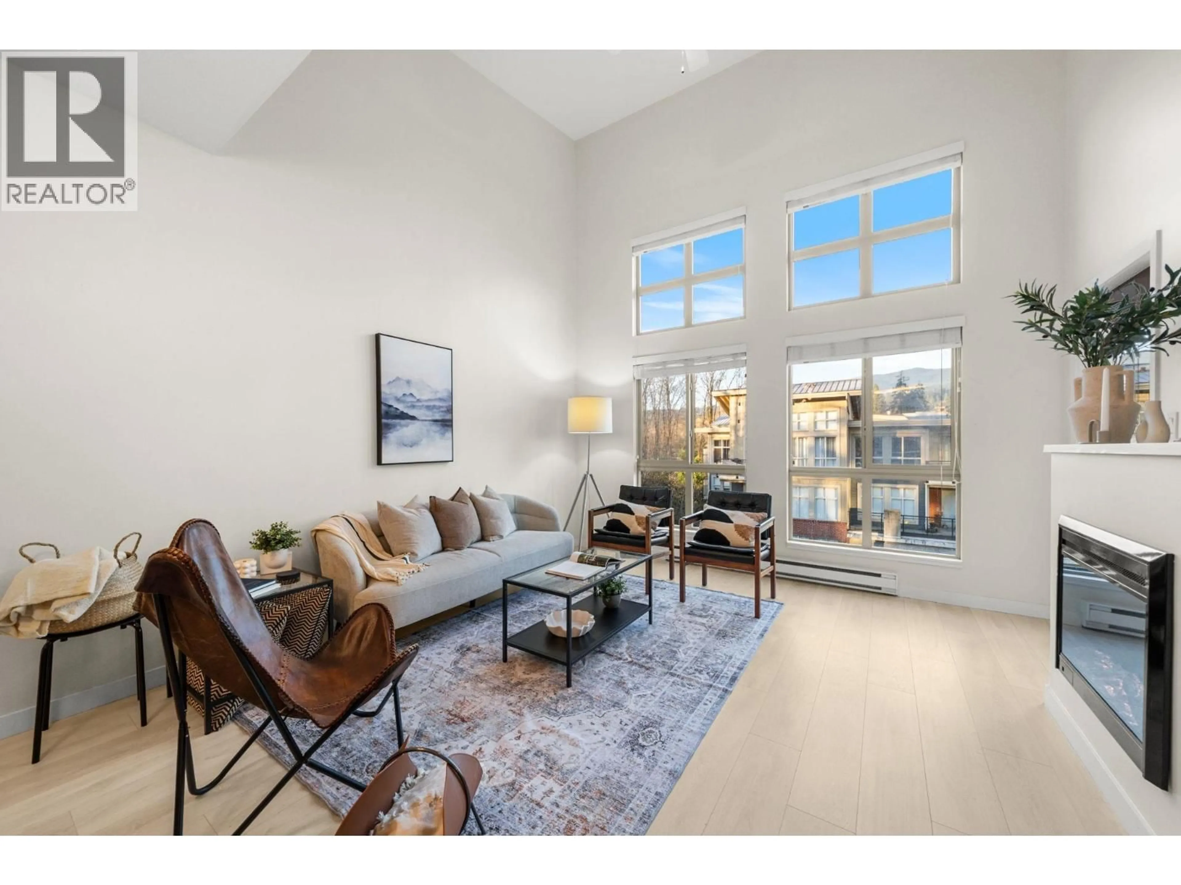 Living room with furniture, unknown for 407 - 201 MORRISSEY ROAD, Port Moody British Columbia V3H0E5