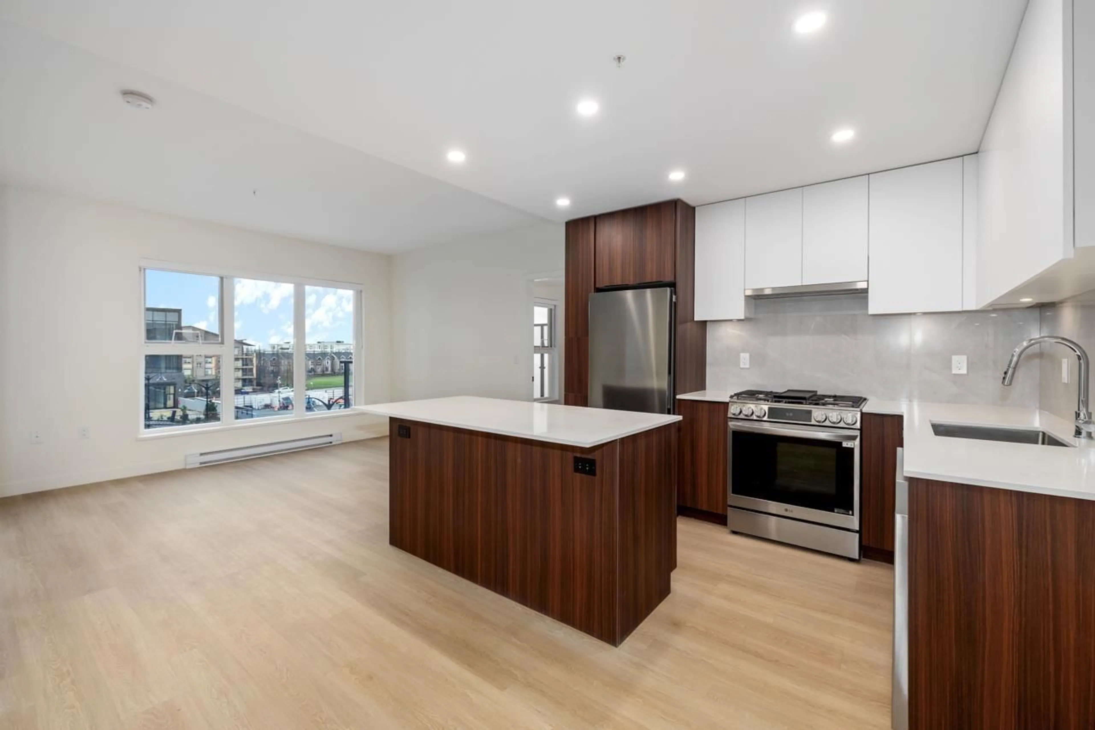 Open concept kitchen, wood/laminate floor for A416 - 7980 206A STREET, Langley British Columbia V2Y3Z8