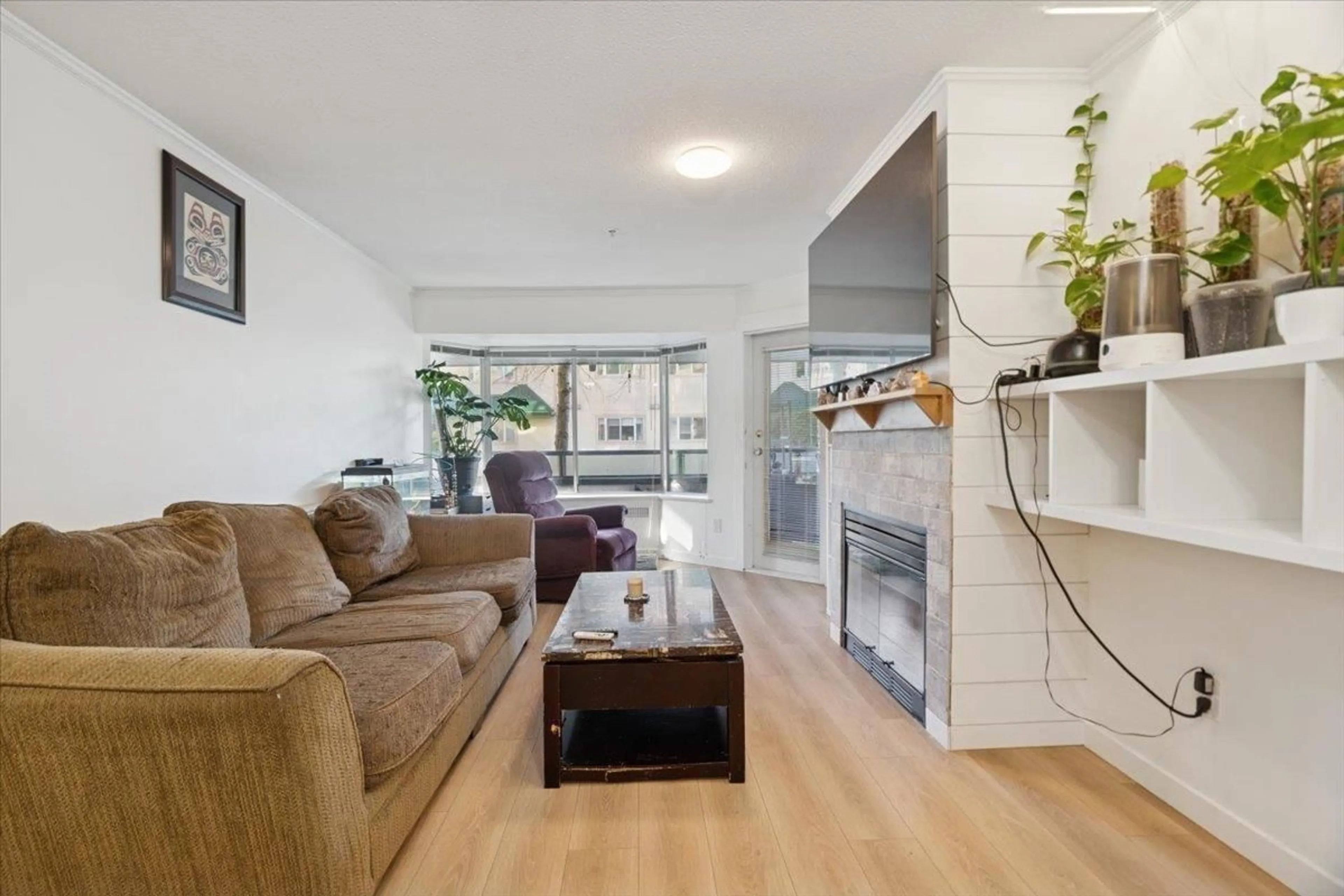 Living room with furniture, wood/laminate floor for 105 - 2962 TRETHEWEY STREET, Abbotsford British Columbia V2T4M3