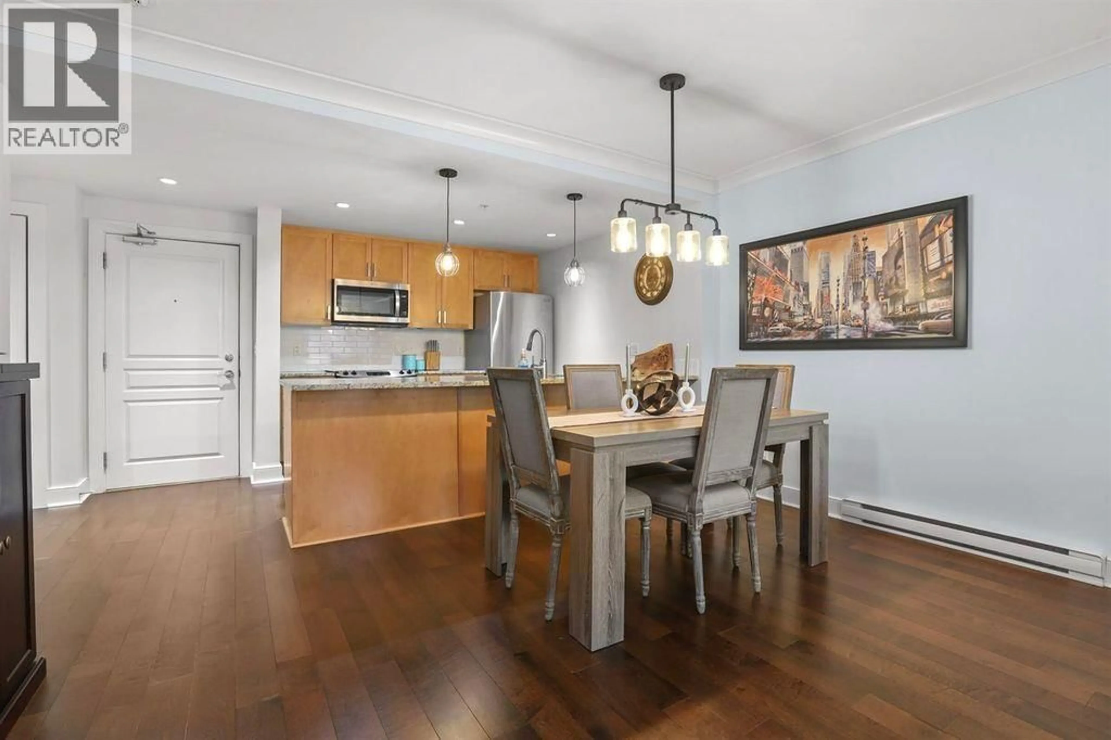 Open concept kitchen, wood/laminate floor for 205 - 5599 14B AVENUE, Tsawwassen British Columbia V4M0A3