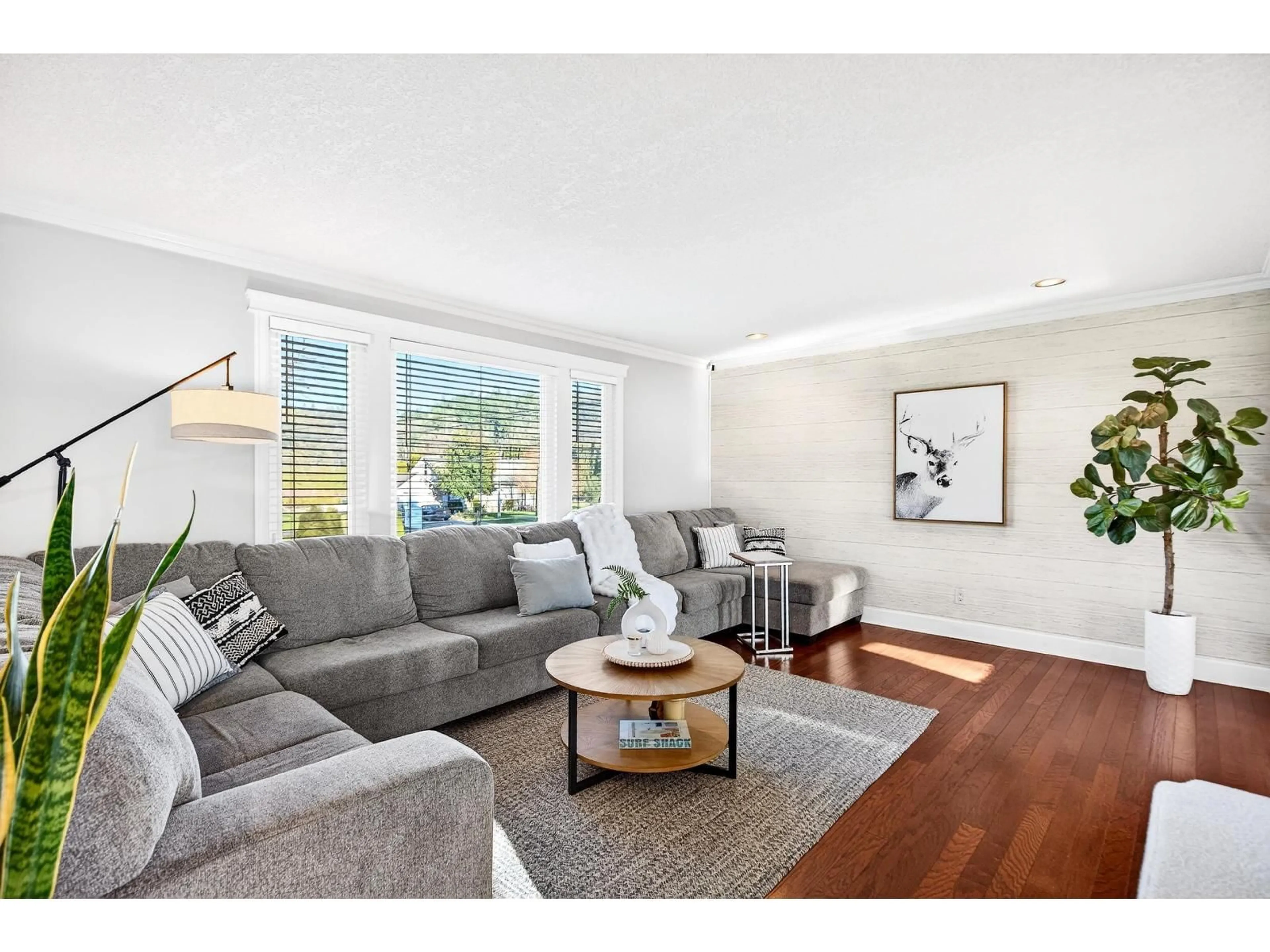 Living room with furniture, wood/laminate floor for 34974 CLAYBURN ROAD, Abbotsford British Columbia V2S7Y9