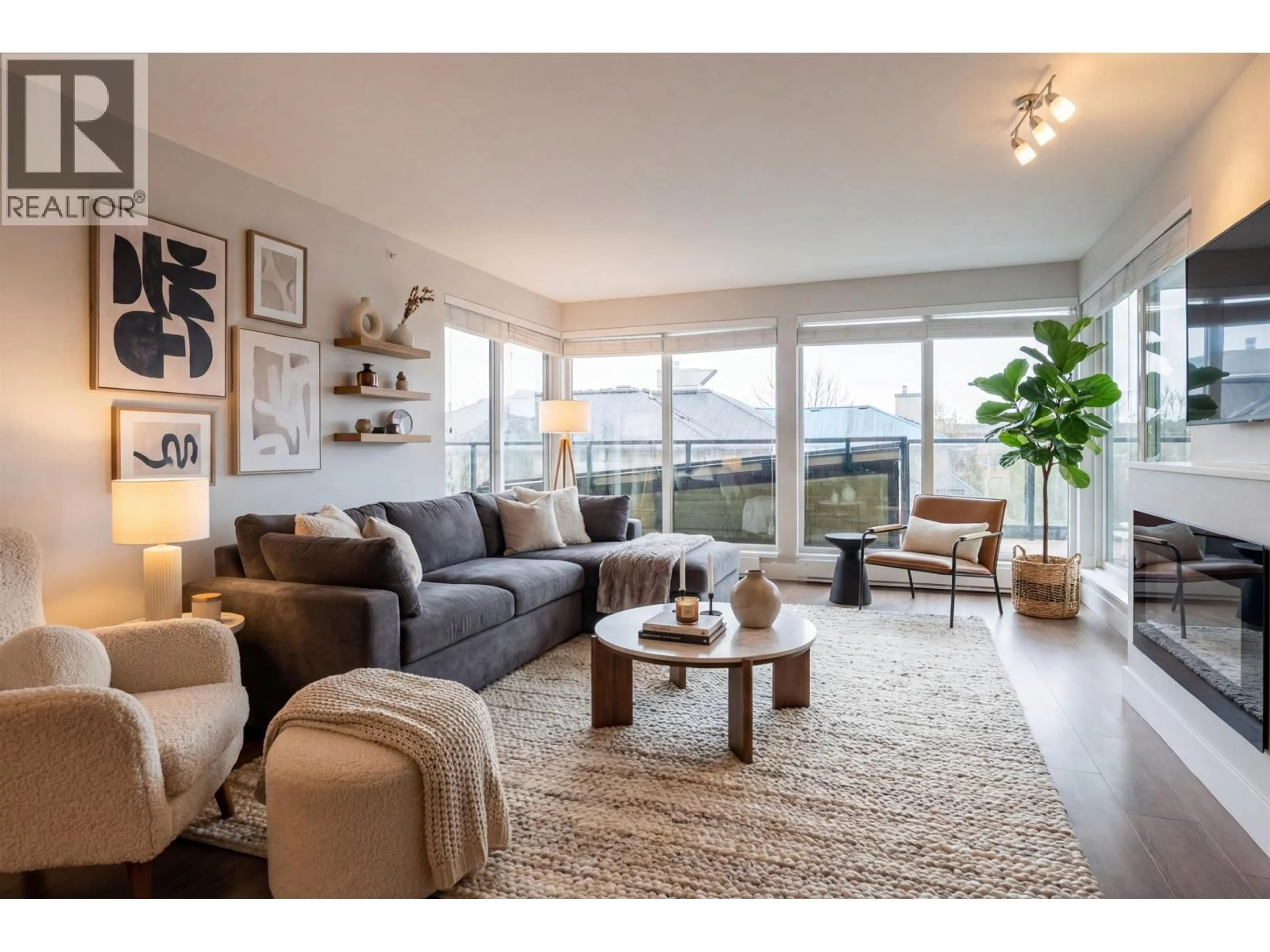 Living room with furniture, wood/laminate floor for 403 - 2460 KELLY AVENUE, Port Coquitlam British Columbia V3C0E3