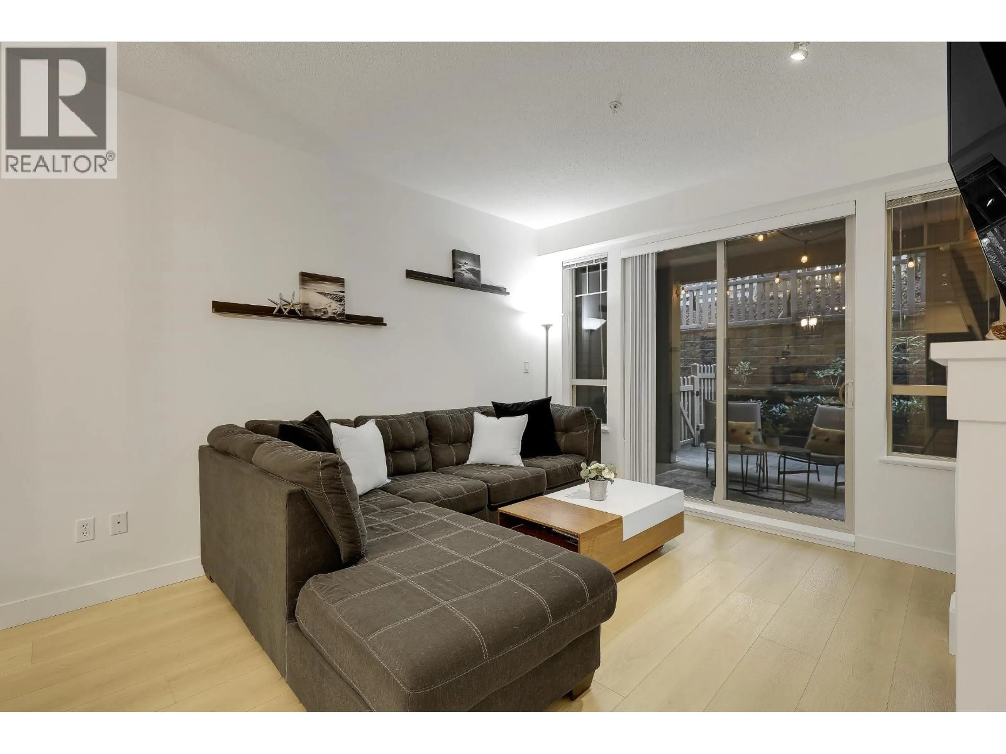 Living room with furniture, wood/laminate floor for #106 - 2959 SILVER SPRINGS BOULEVARD, Coquitlam British Columbia V3E3S5
