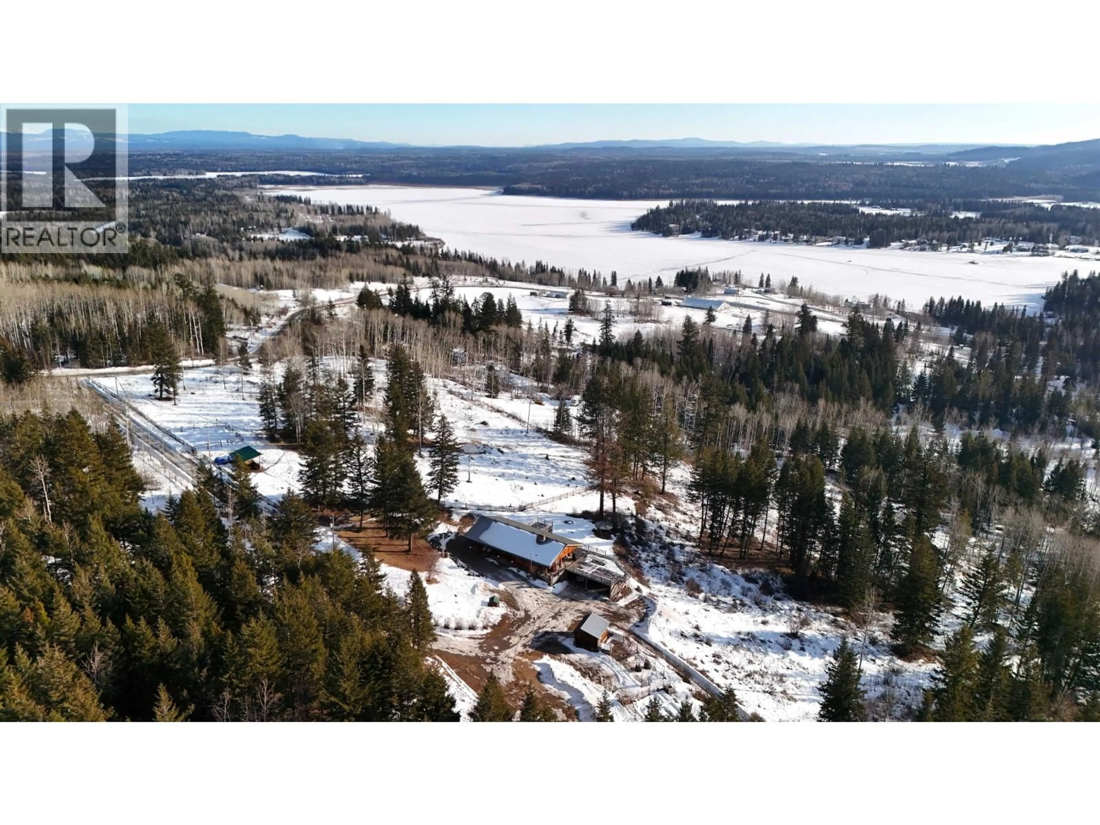 A pic from outside/outdoor area/front of a property/back of a property/a pic from drone, forest/trees view for 2549 ROSE DRIVE, 150 Mile House British Columbia V0K2G0