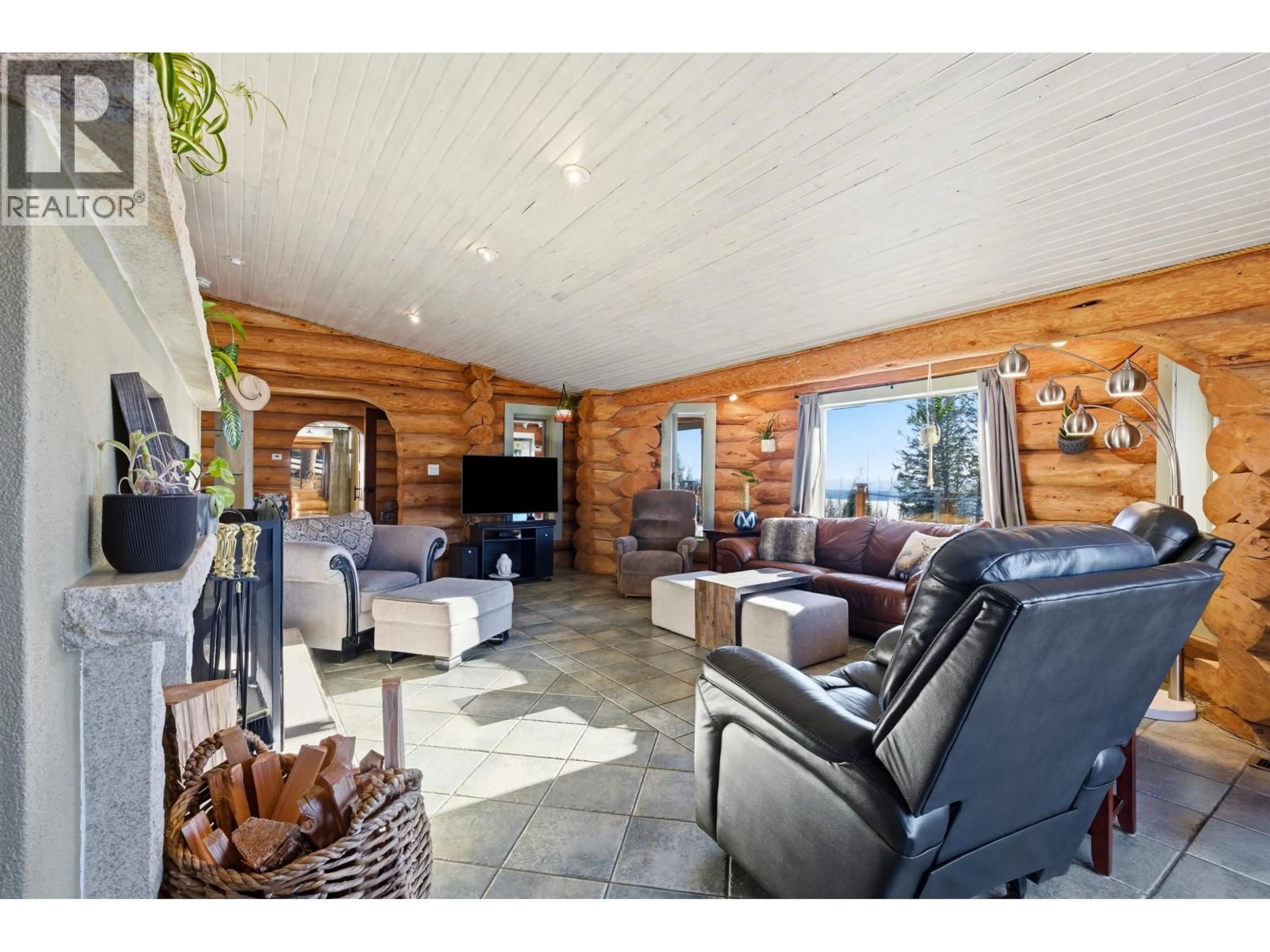 Living room with furniture, wood/laminate floor for 2549 ROSE DRIVE, 150 Mile House British Columbia V0K2G0