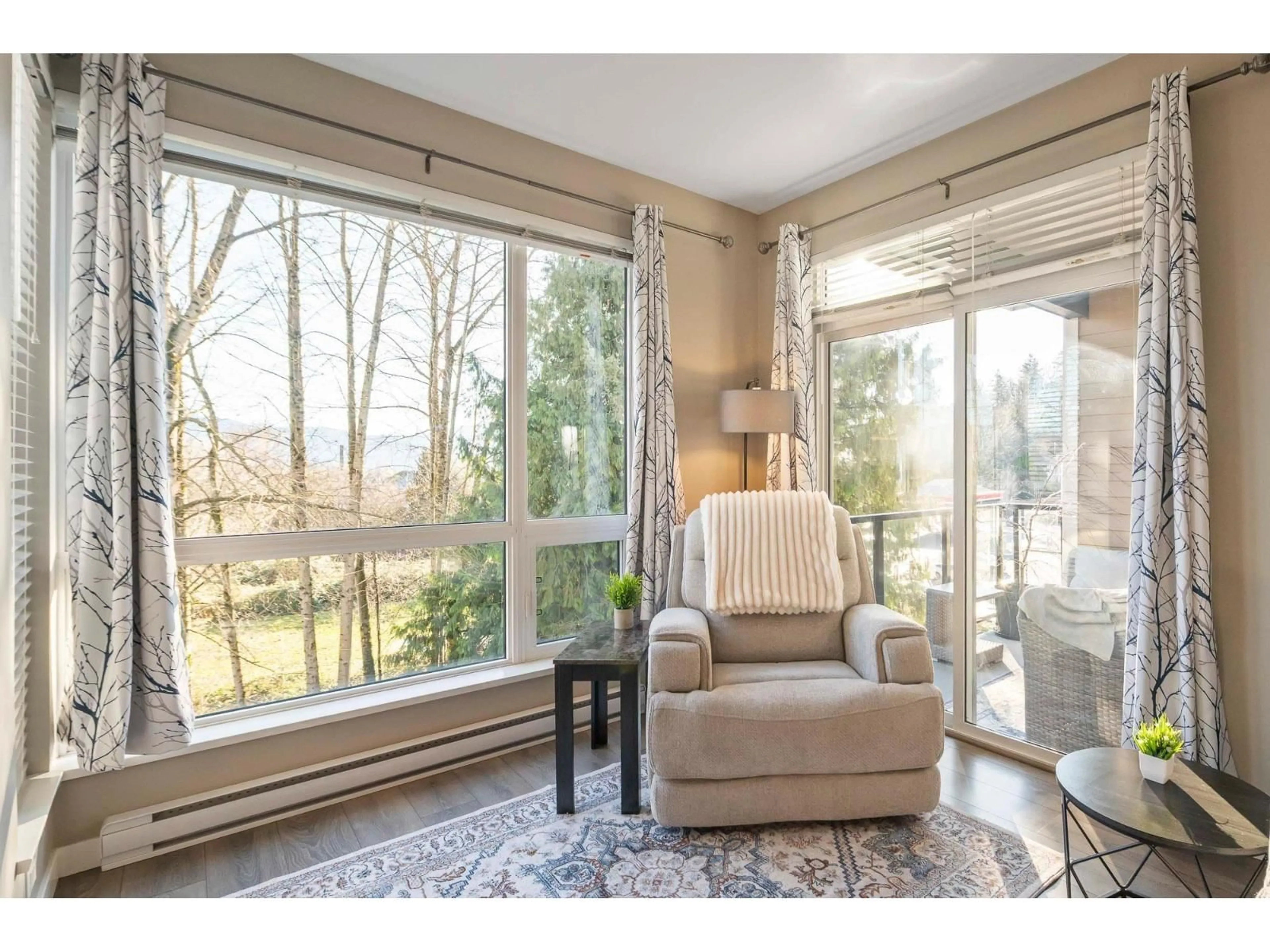 Living room with furniture, wood/laminate floor for 209 - 2238 WHATCOM ROAD, Abbotsford British Columbia V3G0E6