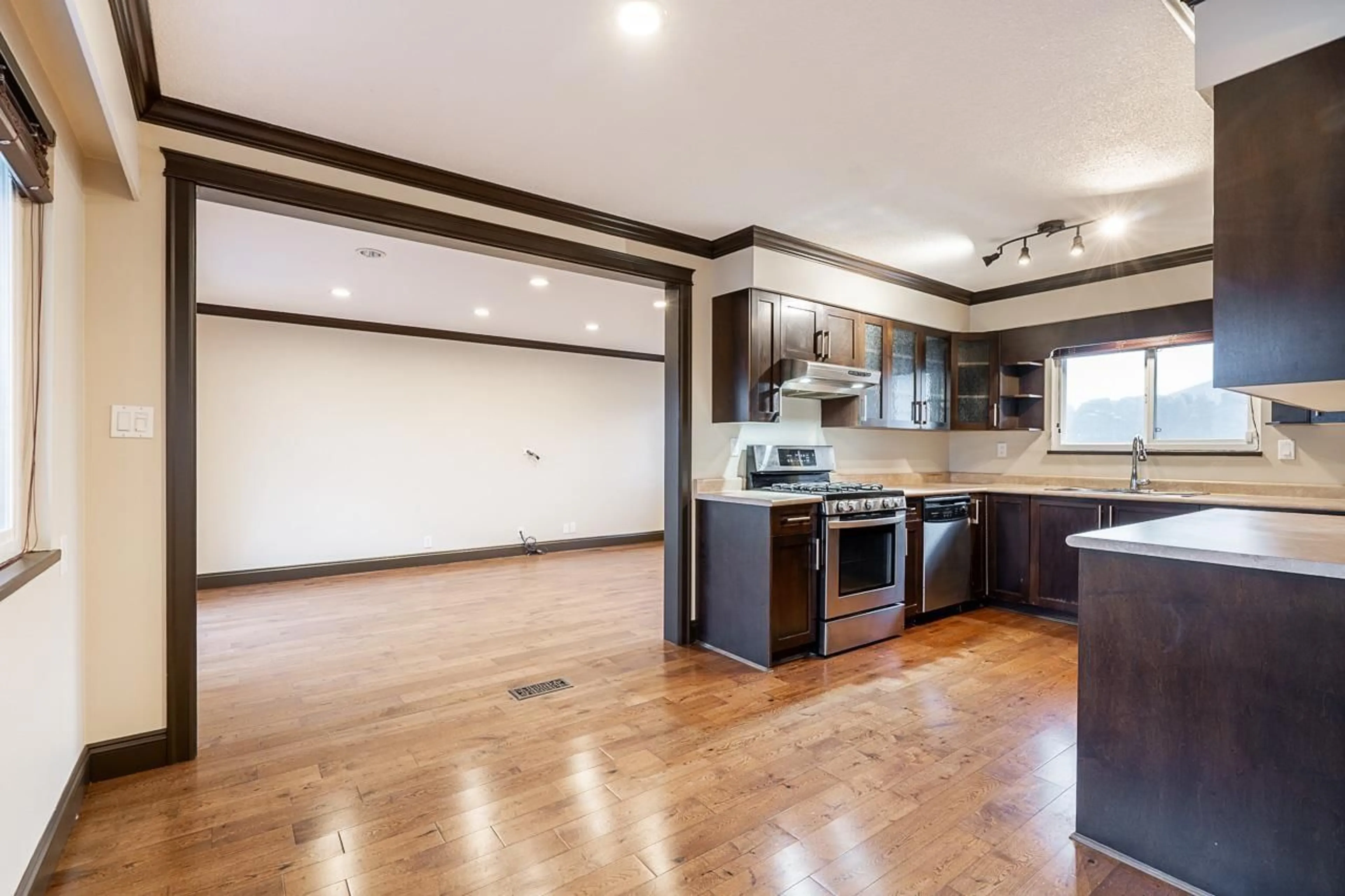Open concept kitchen, wood/laminate floor for 7533 MALTON DRIVE, Delta British Columbia V4C6W7