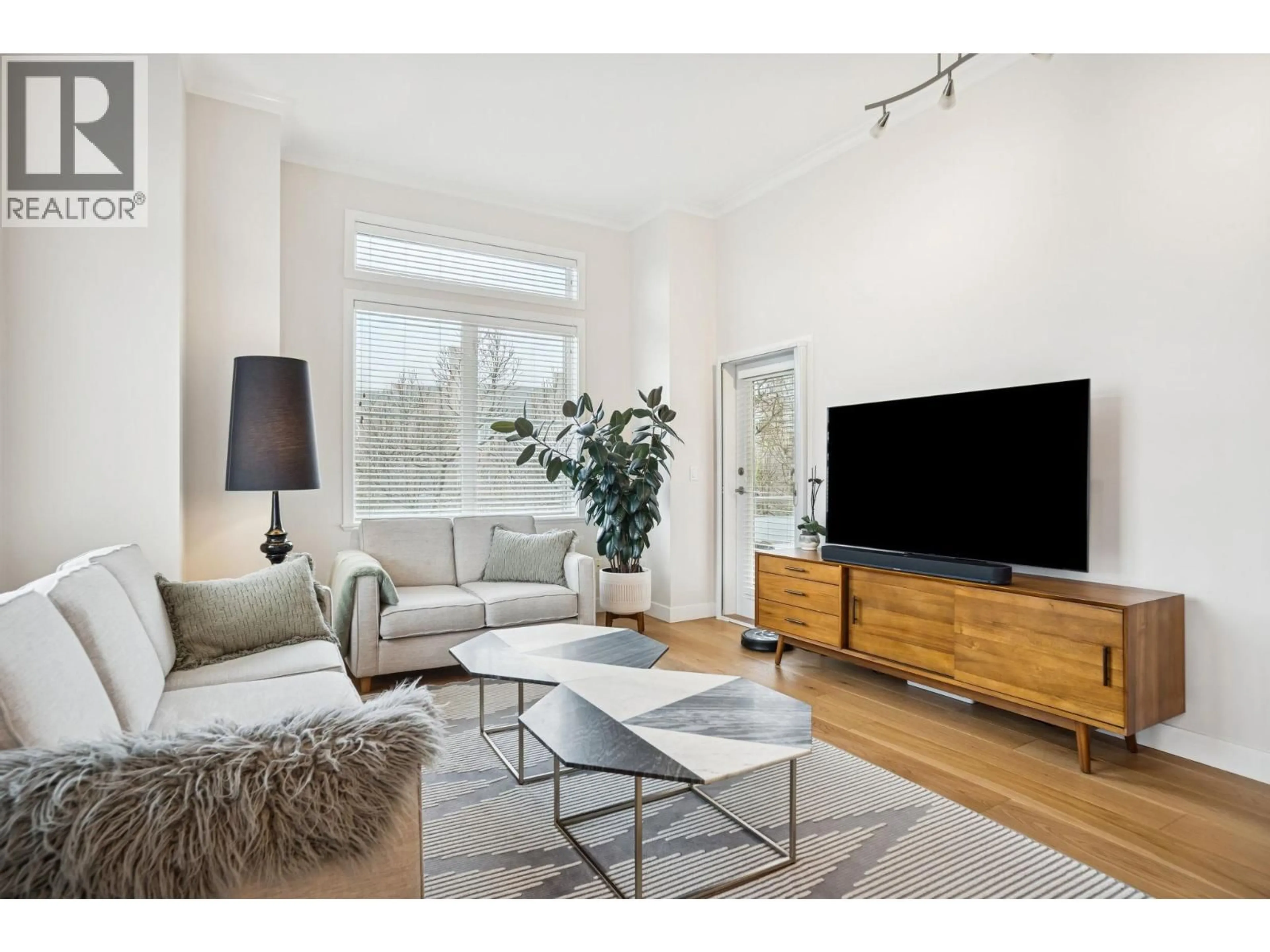 Living room with furniture, wood/laminate floor for 304 - 1375 VIEW CRESCENT, Delta British Columbia V4L0A3