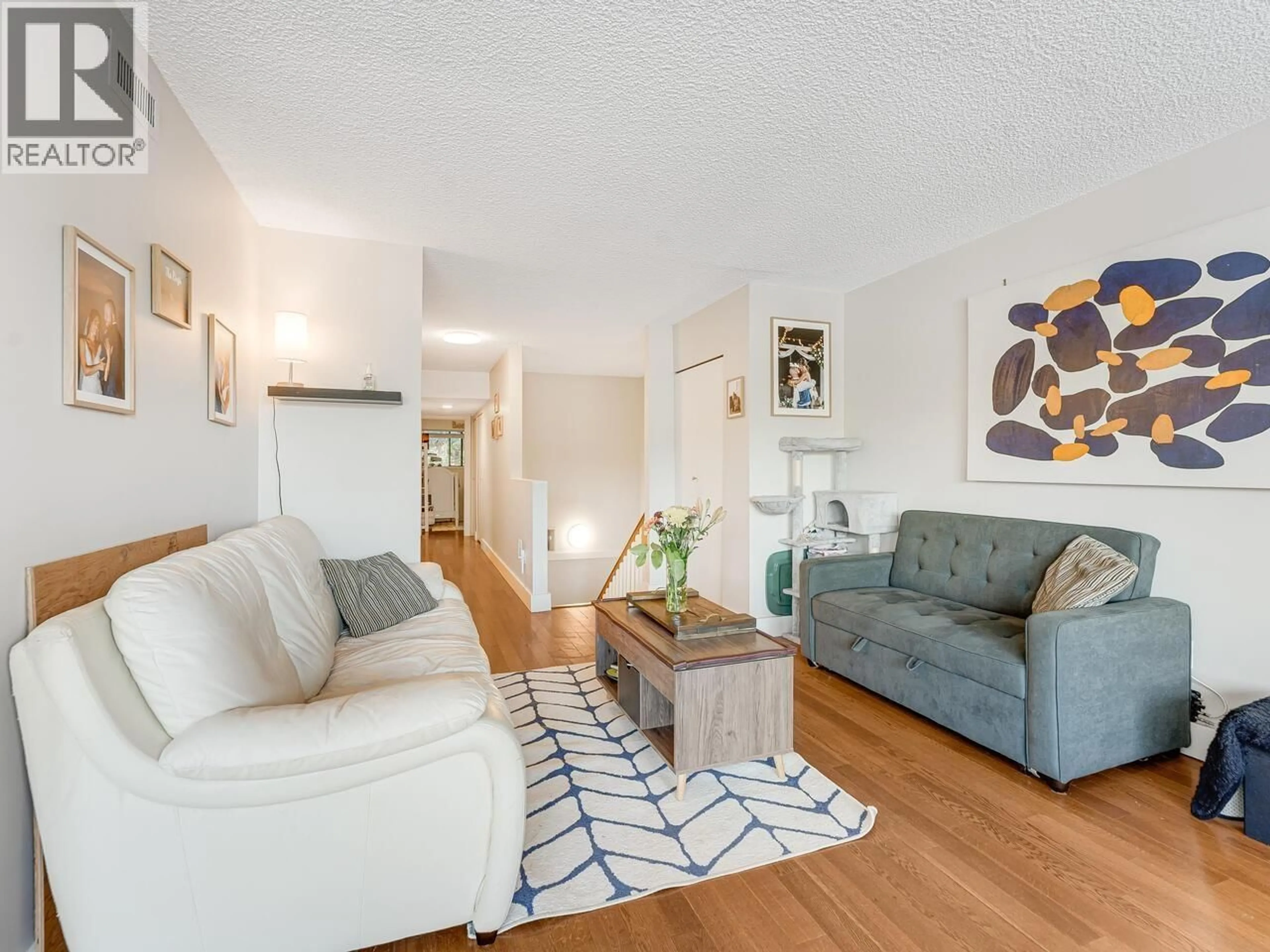 Living room with furniture, wood/laminate floor for 1039 OLD LILLOOET ROAD, North Vancouver British Columbia V7J3H6