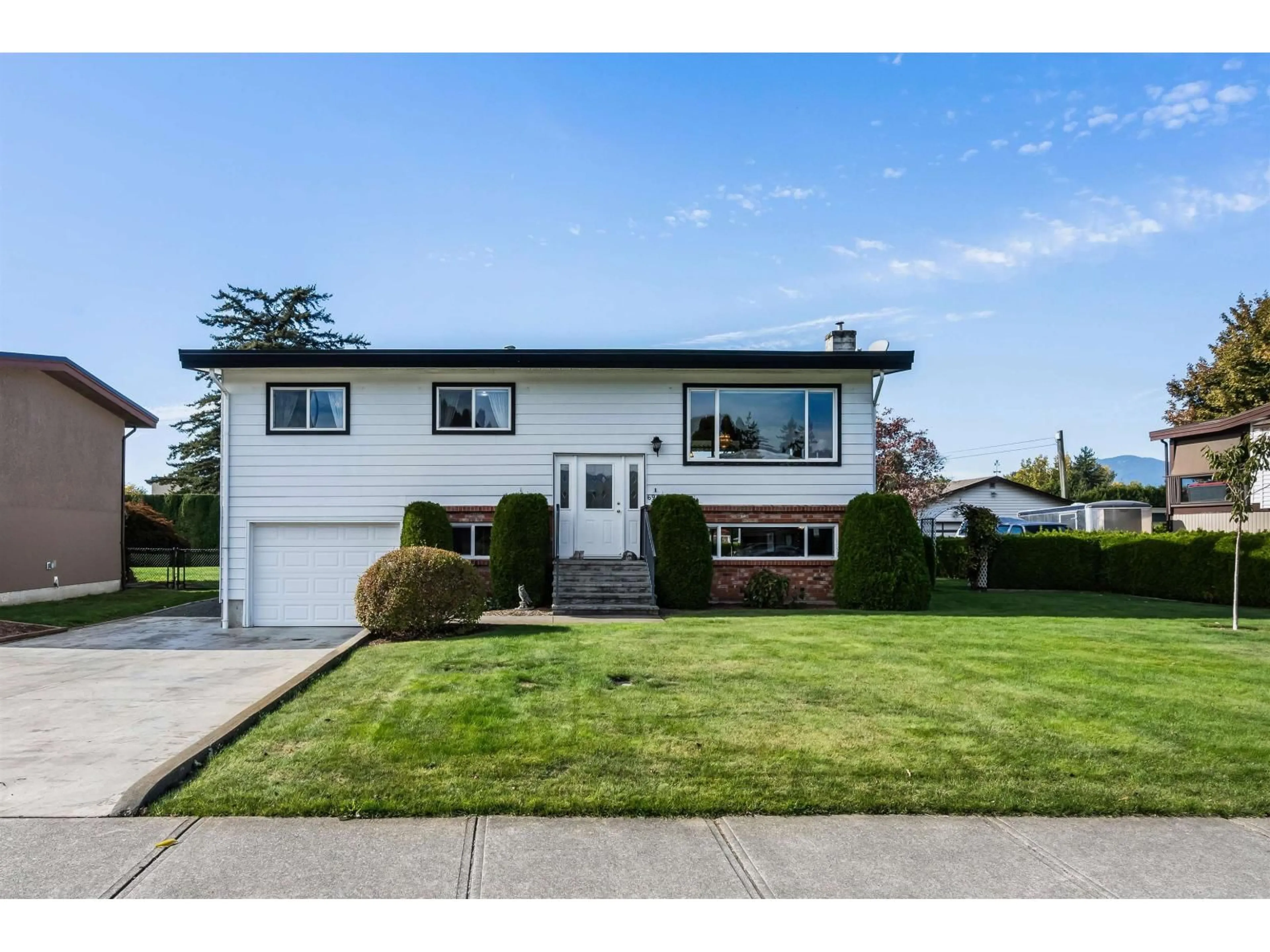 Home with vinyl exterior material, street for 6961 SHEFFIELD WAY, Chilliwack British Columbia V2R3T2