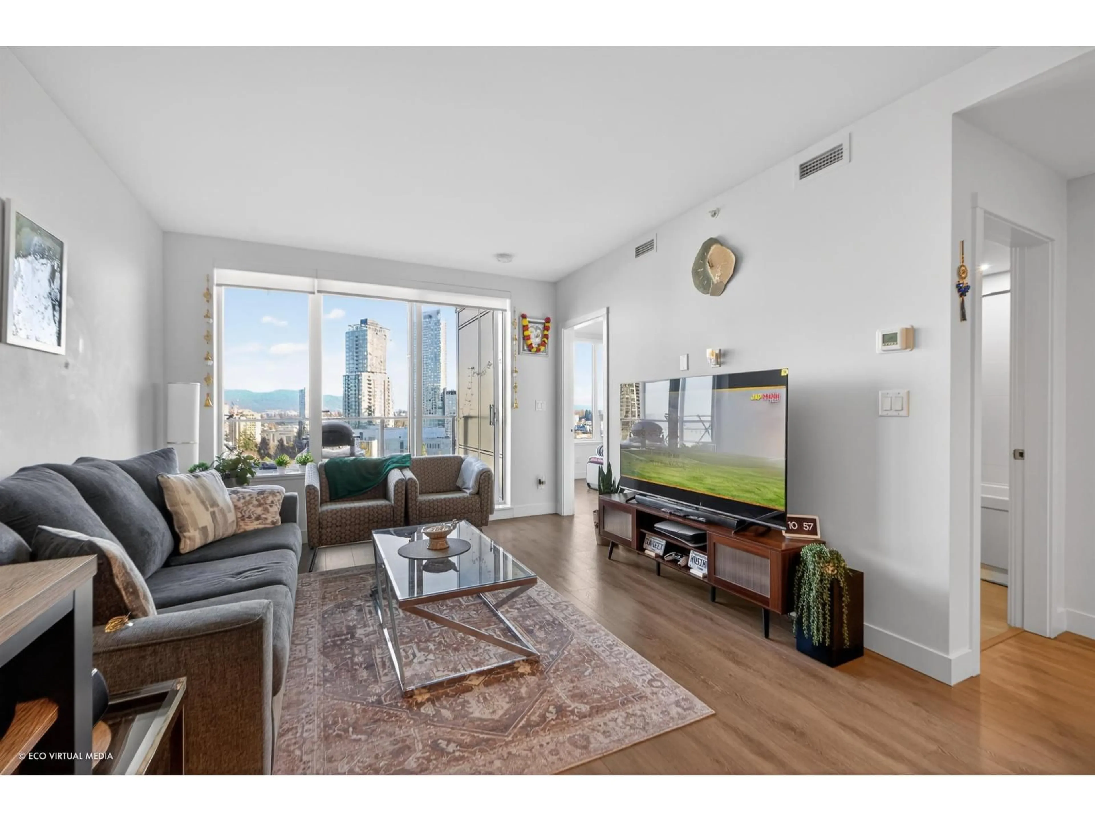 Living room with furniture, wood/laminate floor for 1101 - 13359 OLD YALE ROAD, Surrey British Columbia V3T0S4