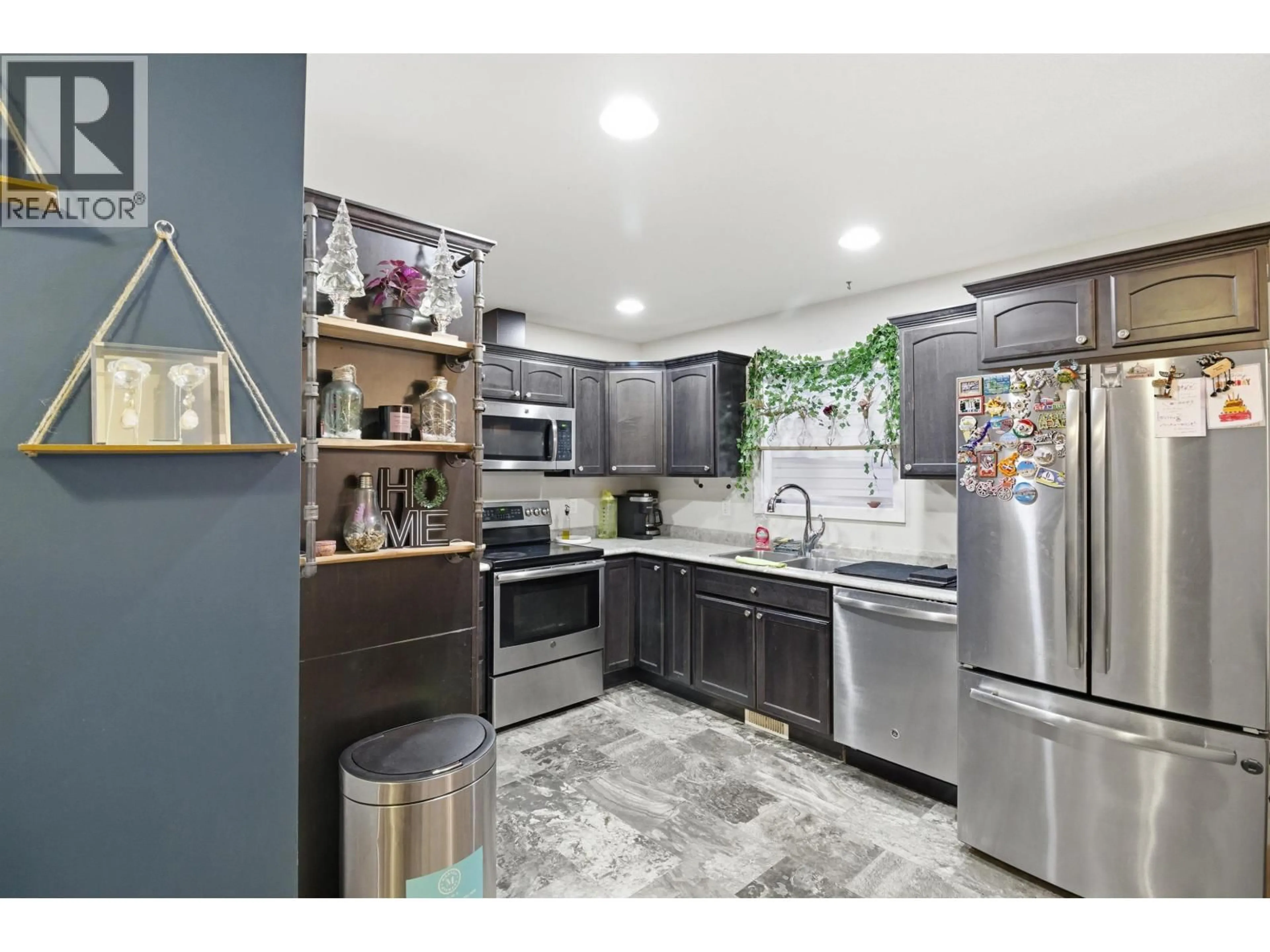 Open concept kitchen, ceramic/tile floor for 7617 89 AVENUE, Fort St. John British Columbia V1J5A1