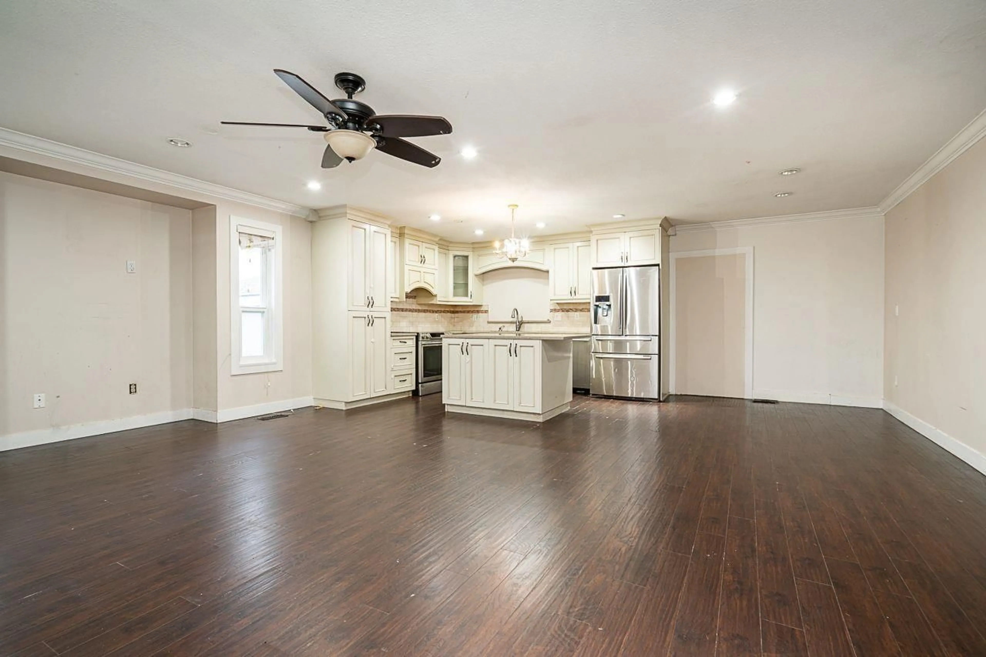 Open concept kitchen, wood/laminate floor for 13032 61 AVENUE, Surrey British Columbia V3X2H5