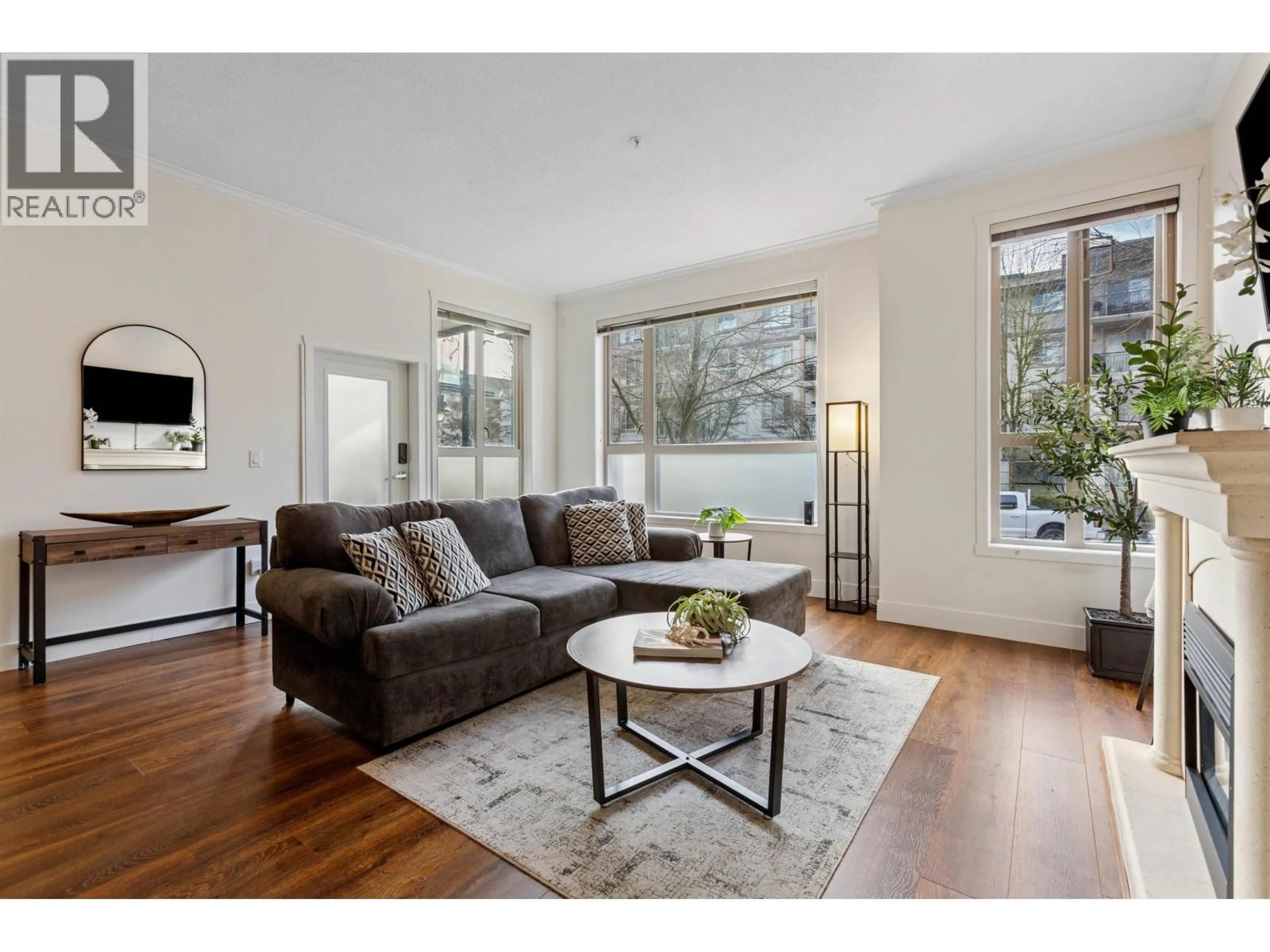 Living room with furniture, wood/laminate floor for 104 - 2628 MAPLE STREET, Port Coquitlam British Columbia V3C0E2