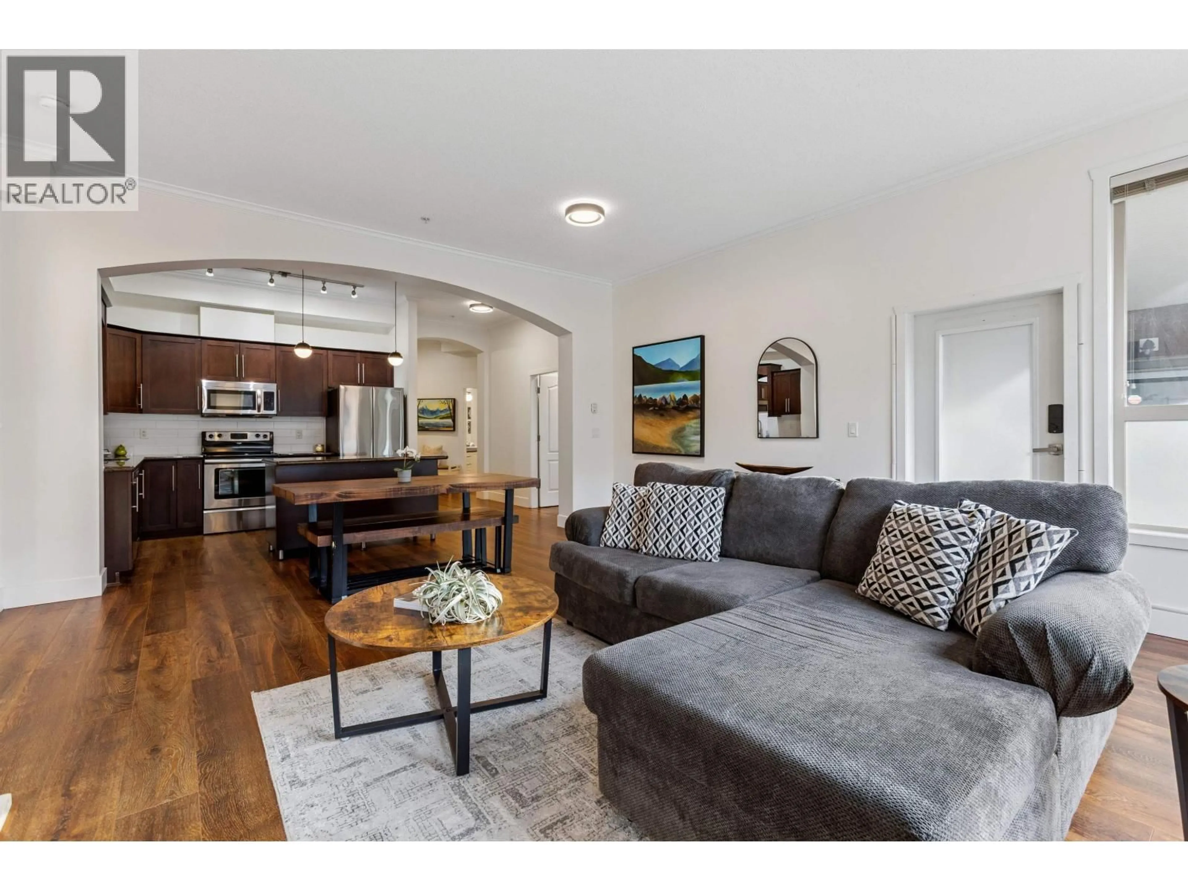 Living room with furniture, wood/laminate floor for 104 - 2628 MAPLE STREET, Port Coquitlam British Columbia V3C0E2