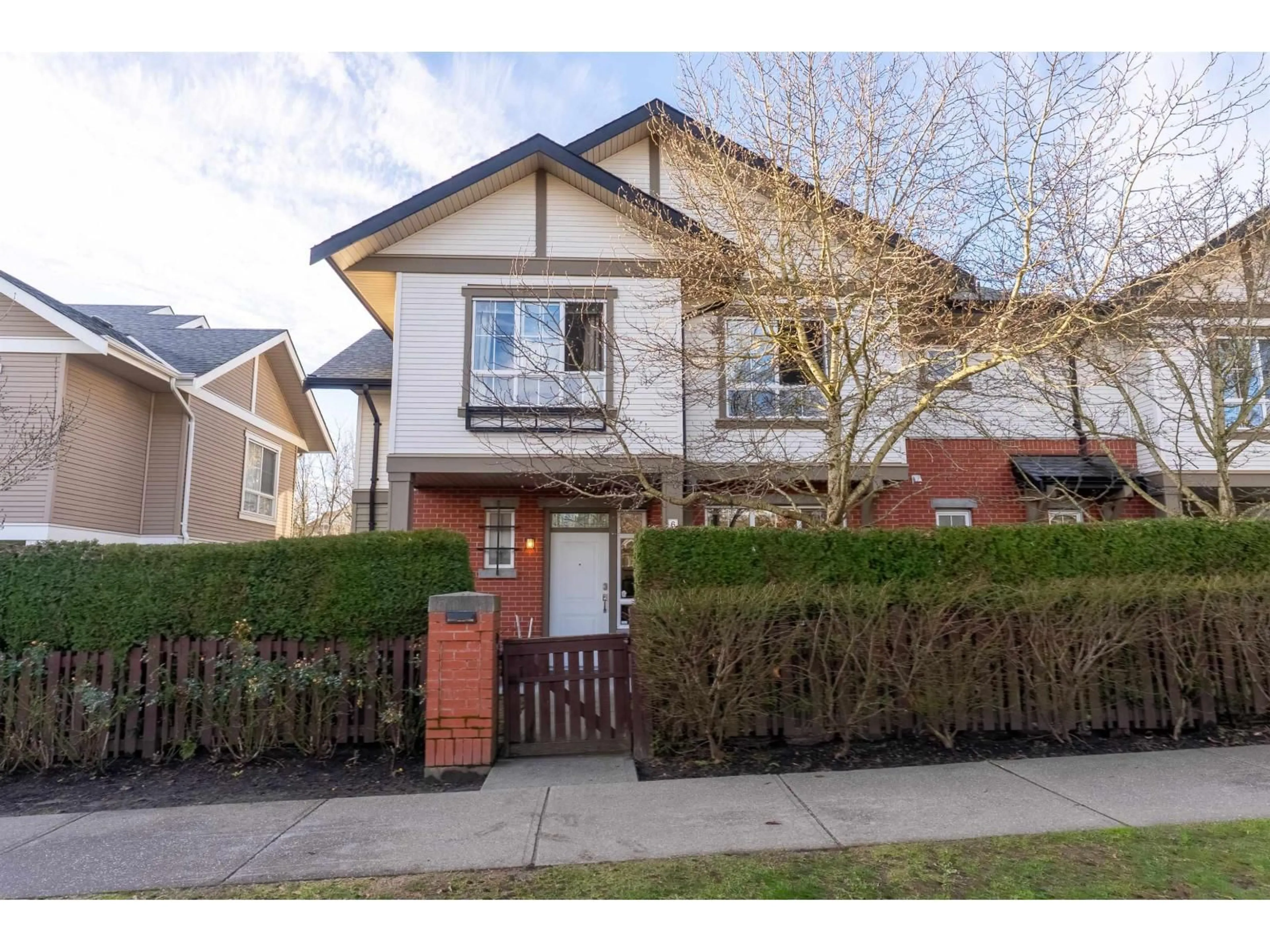 Home with brick exterior material, street for 6879 195A STREET, Surrey British Columbia V4N6K3