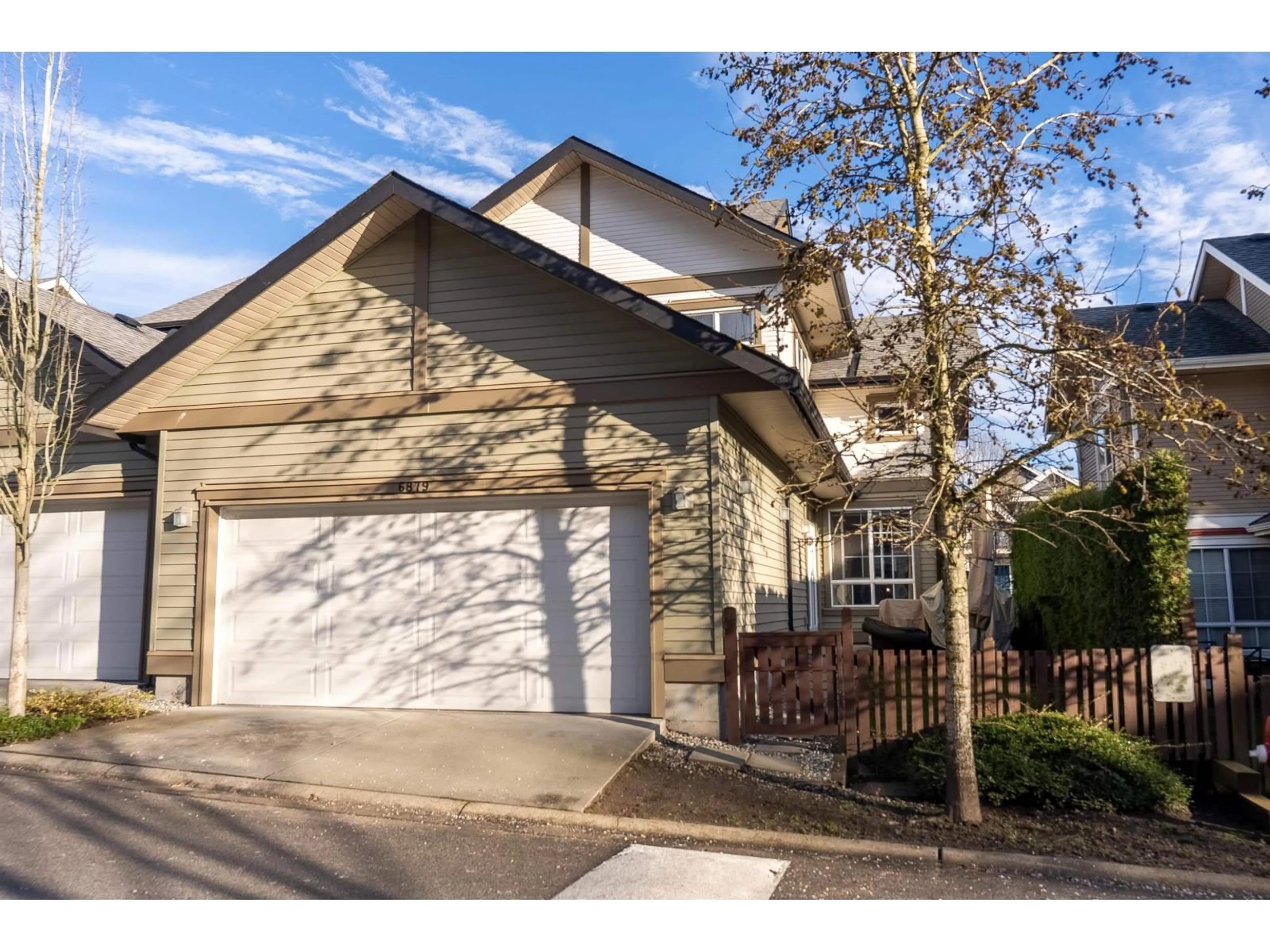 Home with vinyl exterior material, street for 6879 195A STREET, Surrey British Columbia V4N6K3