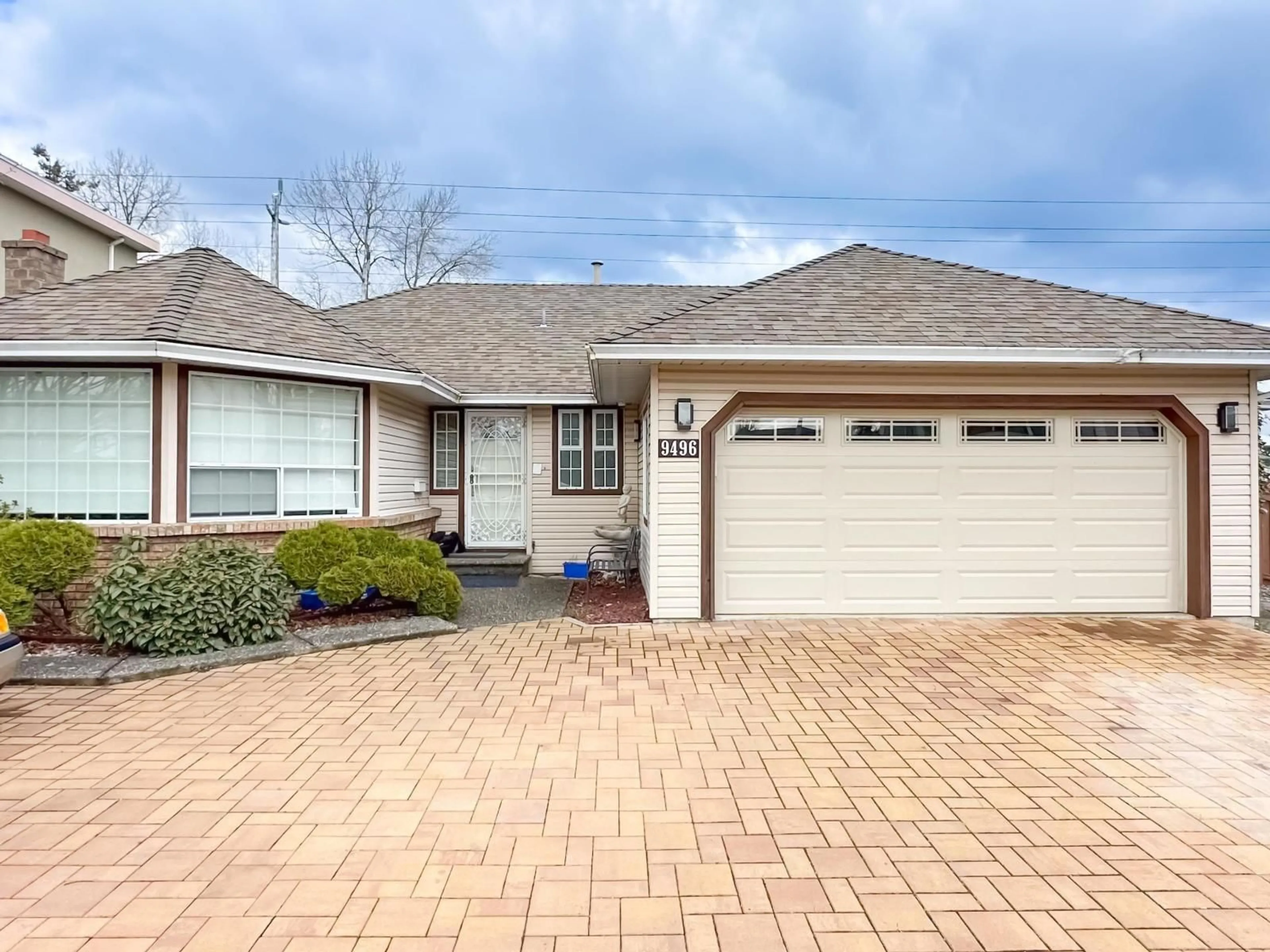 Home with brick exterior material, street for 9496 160A STREET, Surrey British Columbia V4N2P4