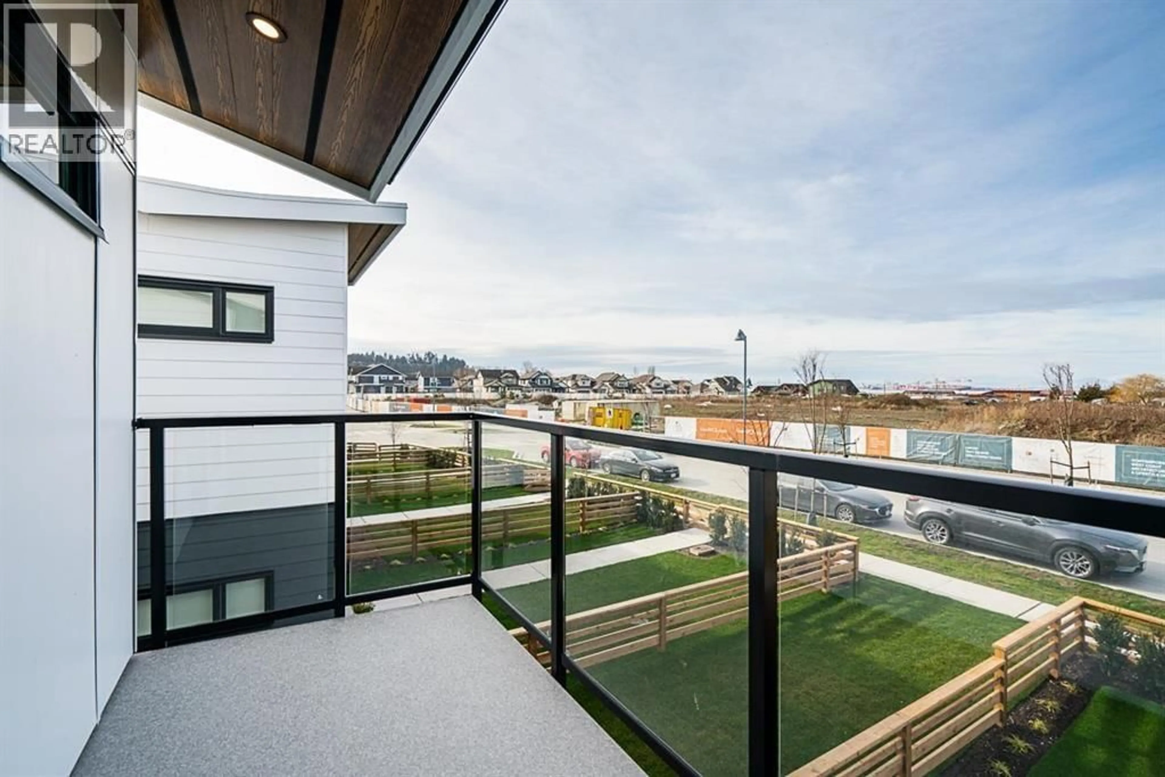 Patio, city buildings view from balcony for 1978 OSPREY DRIVE, Tsawwassen British Columbia V4M0E8