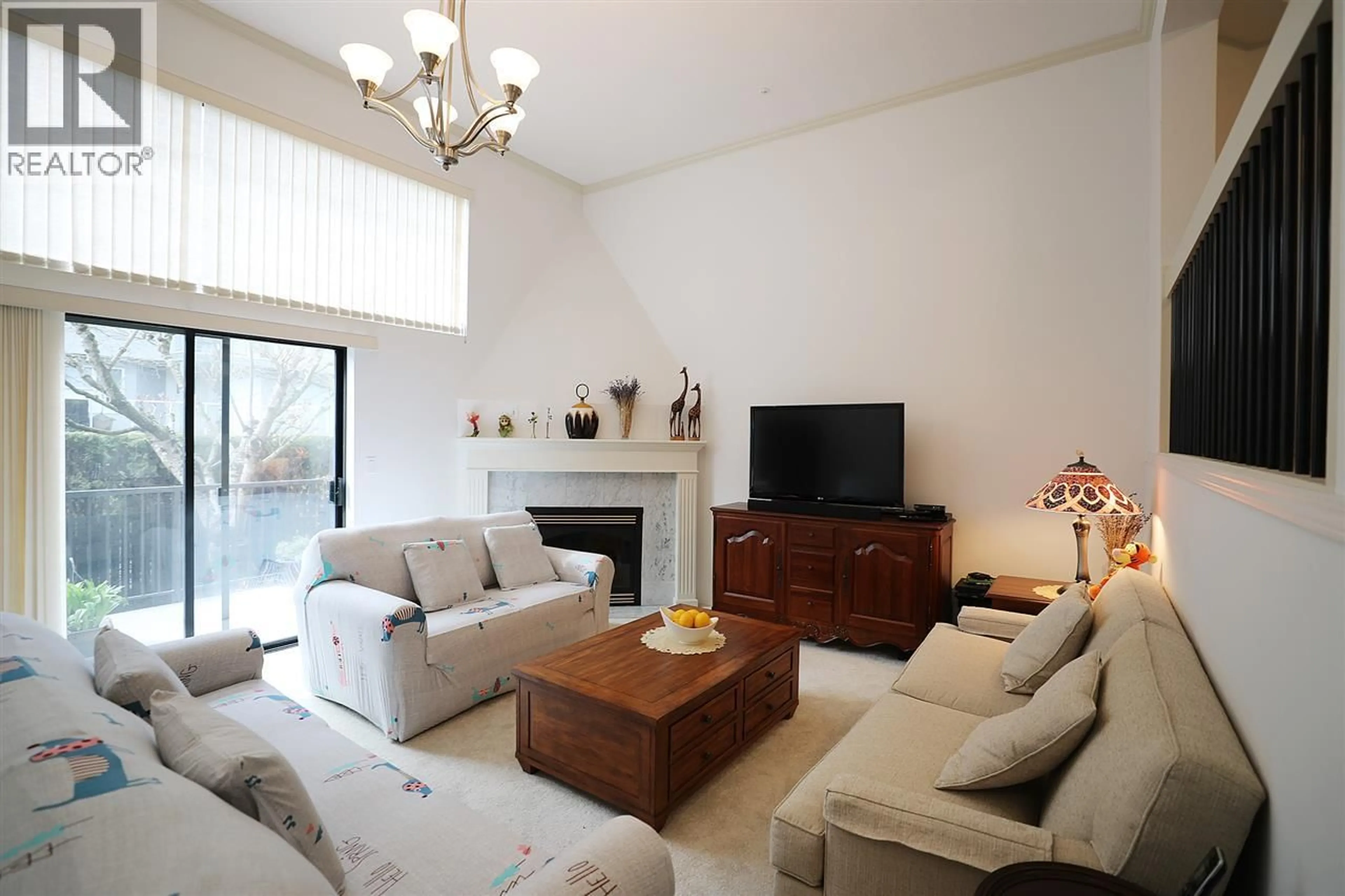 Living room with furniture, wood/laminate floor for 34 - 8591 BLUNDELL ROAD, Richmond British Columbia V6Y1K2