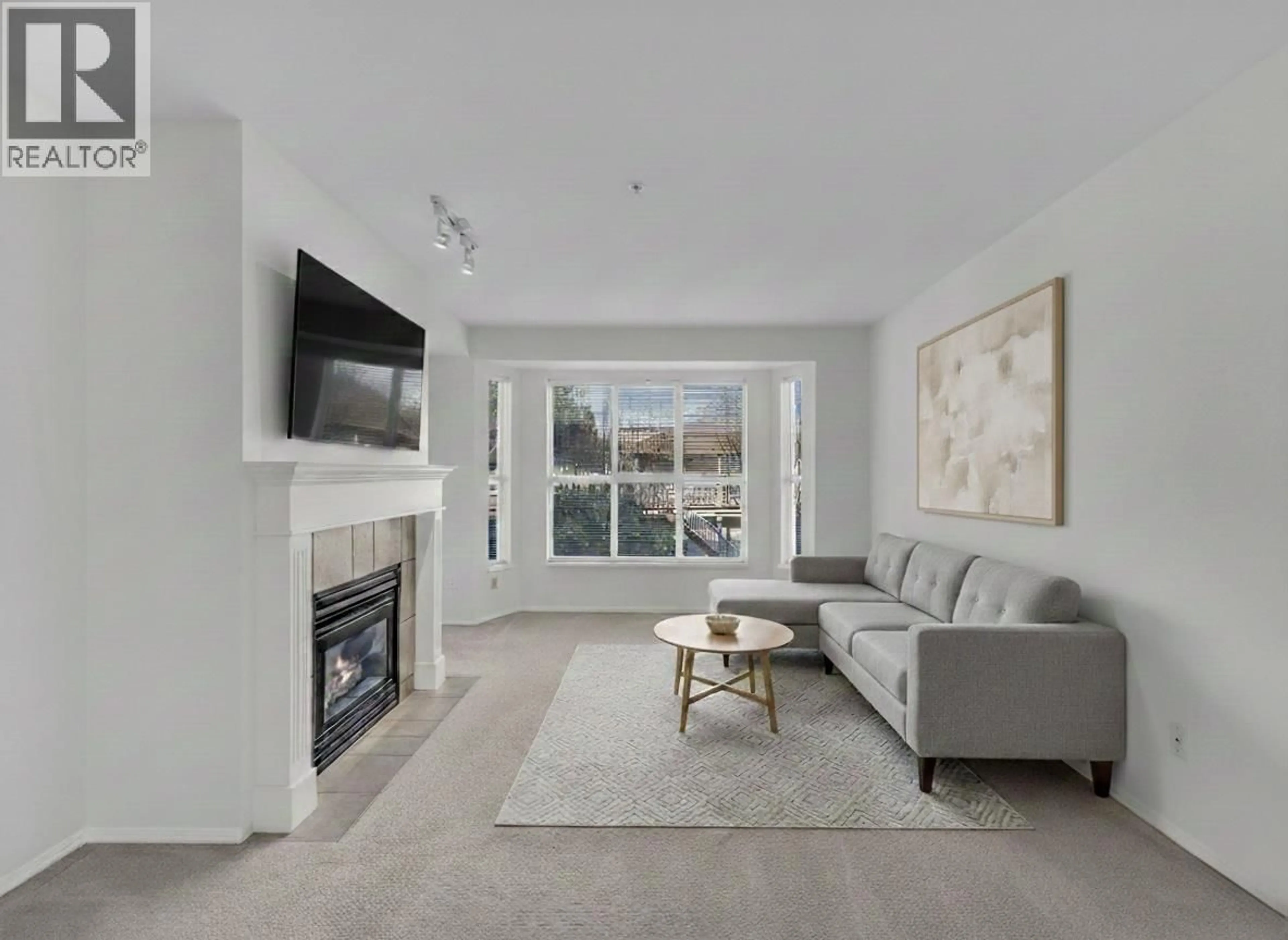 Living room with furniture, unknown for 201 - 2393 WELCHER AVENUE, Port Coquitlam British Columbia V3C1X6