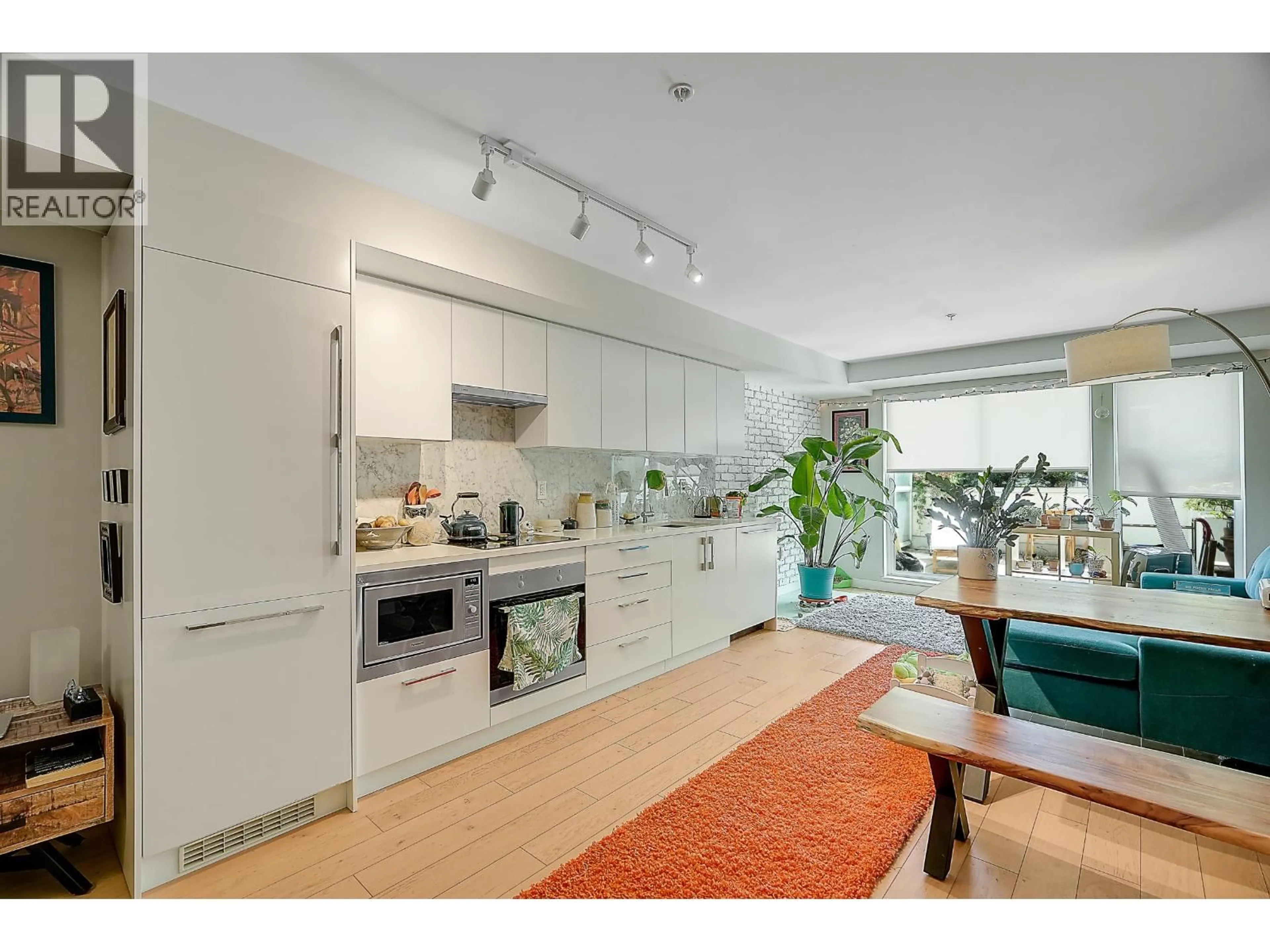 Open concept kitchen, unknown for 210 - 2508 FRASER STREET, Vancouver British Columbia V5T3V4