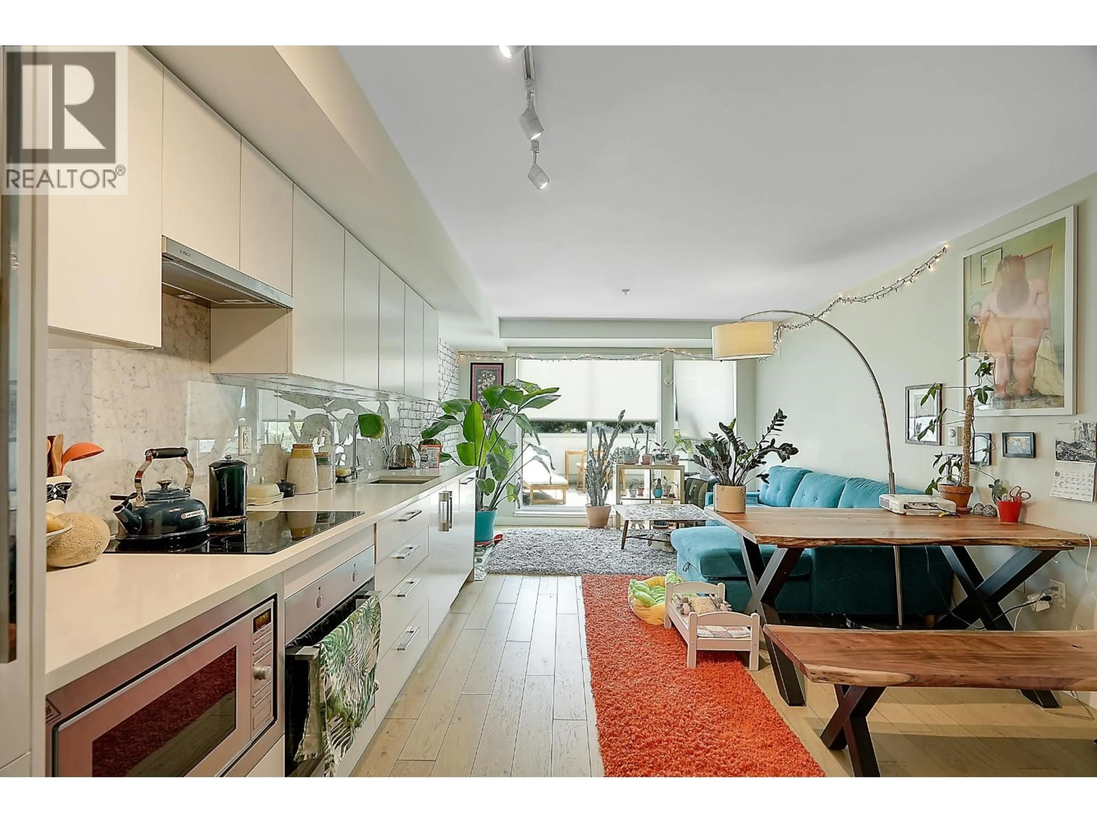 Open concept kitchen, unknown for 210 - 2508 FRASER STREET, Vancouver British Columbia V5T3V4