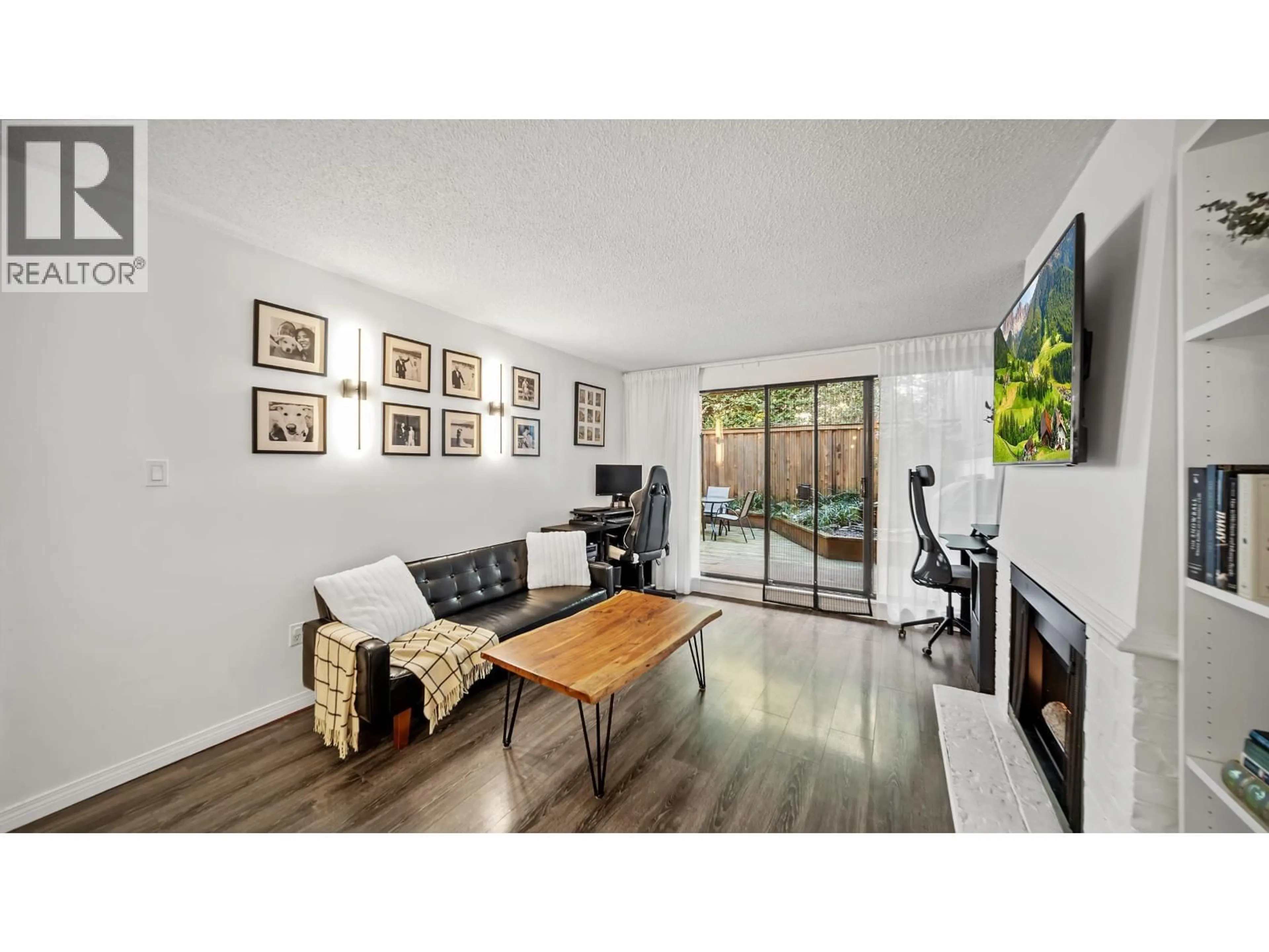 Living room with furniture, wood/laminate floor for 214 - 5340 HASTINGS STREET, Burnaby British Columbia V5B1R1