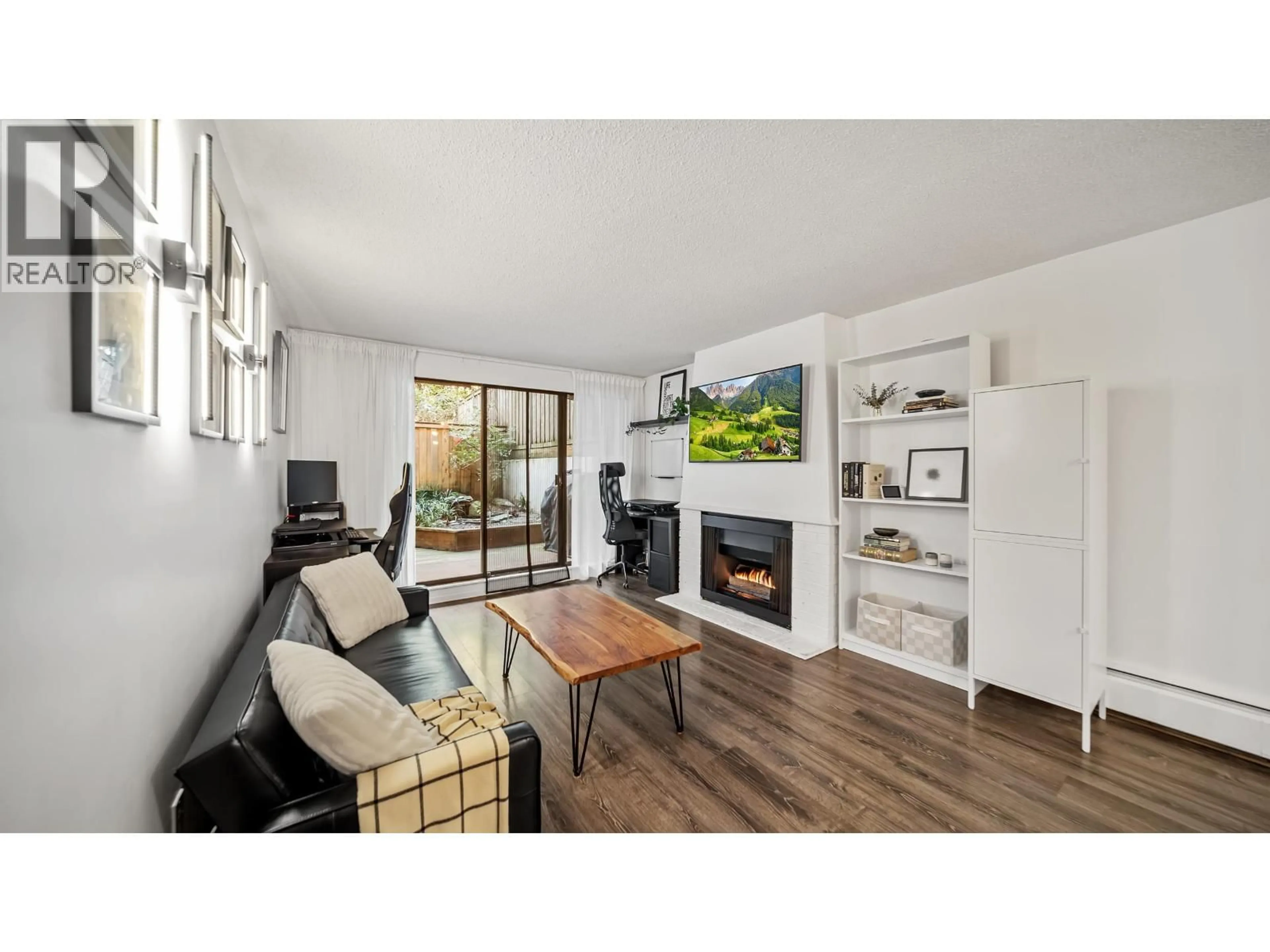 Living room with furniture, wood/laminate floor for 214 - 5340 HASTINGS STREET, Burnaby British Columbia V5B1R1