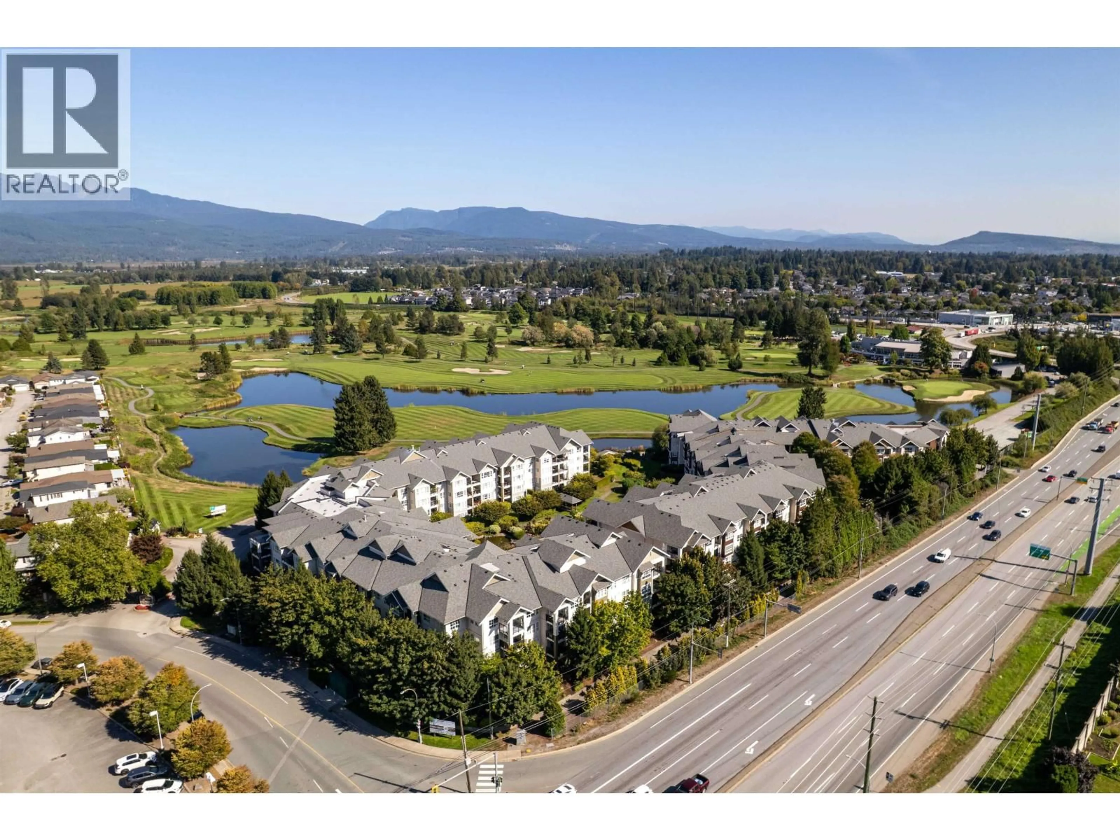 A pic from outside/outdoor area/front of a property/back of a property/a pic from drone, mountain view for 113 - 19677 MEADOW GARDENS WAY, Pitt Meadows British Columbia V3Y0A2