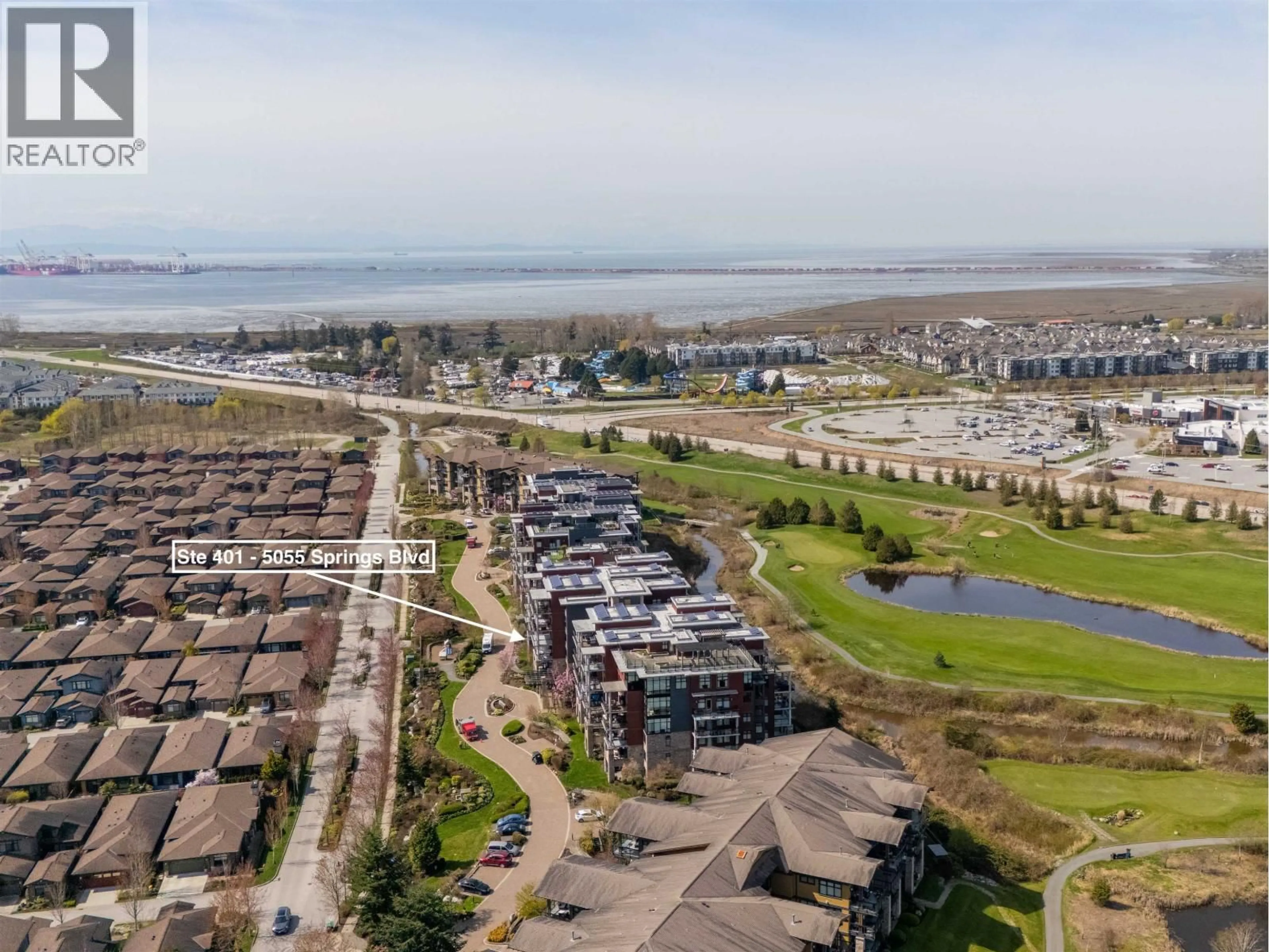 A pic from outside/outdoor area/front of a property/back of a property/a pic from drone, water/lake/river/ocean view for 401 - 5055 SPRINGS BOULEVARD, Delta British Columbia V4M0A5