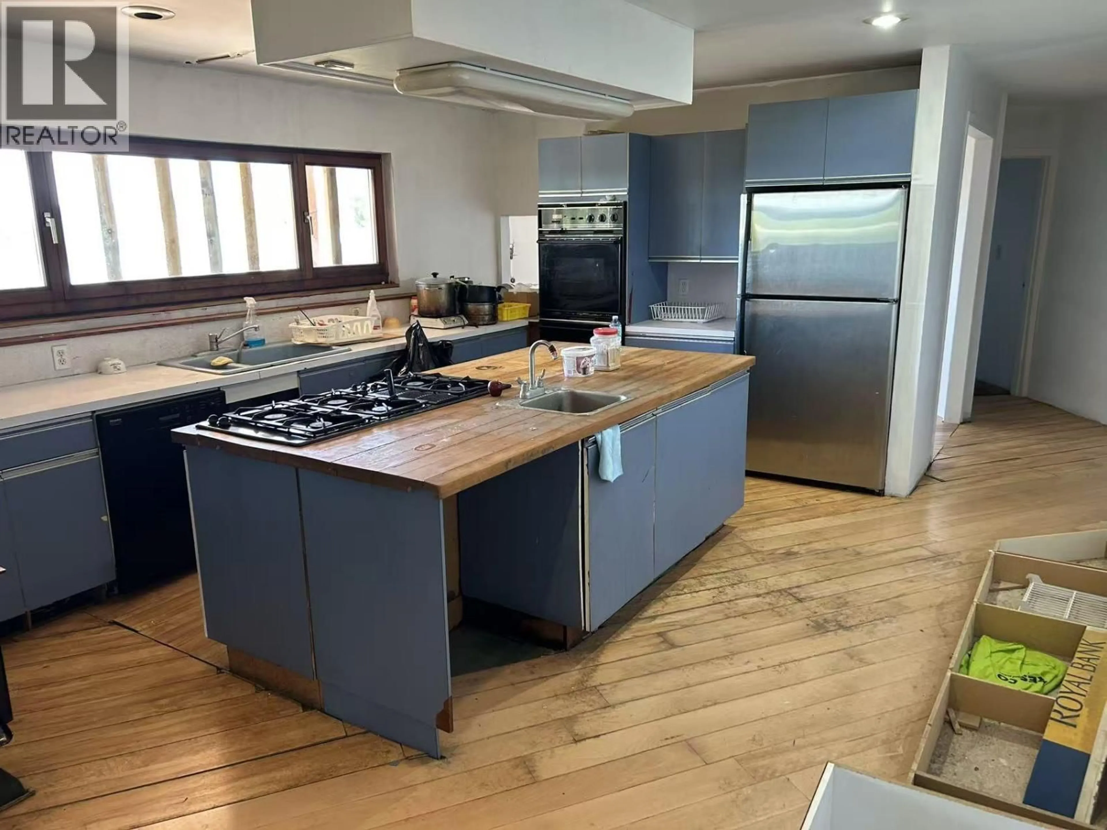 Open concept kitchen, wood/laminate floor for 6593 LITTLE GREEN LAKE ROAD, Green Lake British Columbia V0K2K1