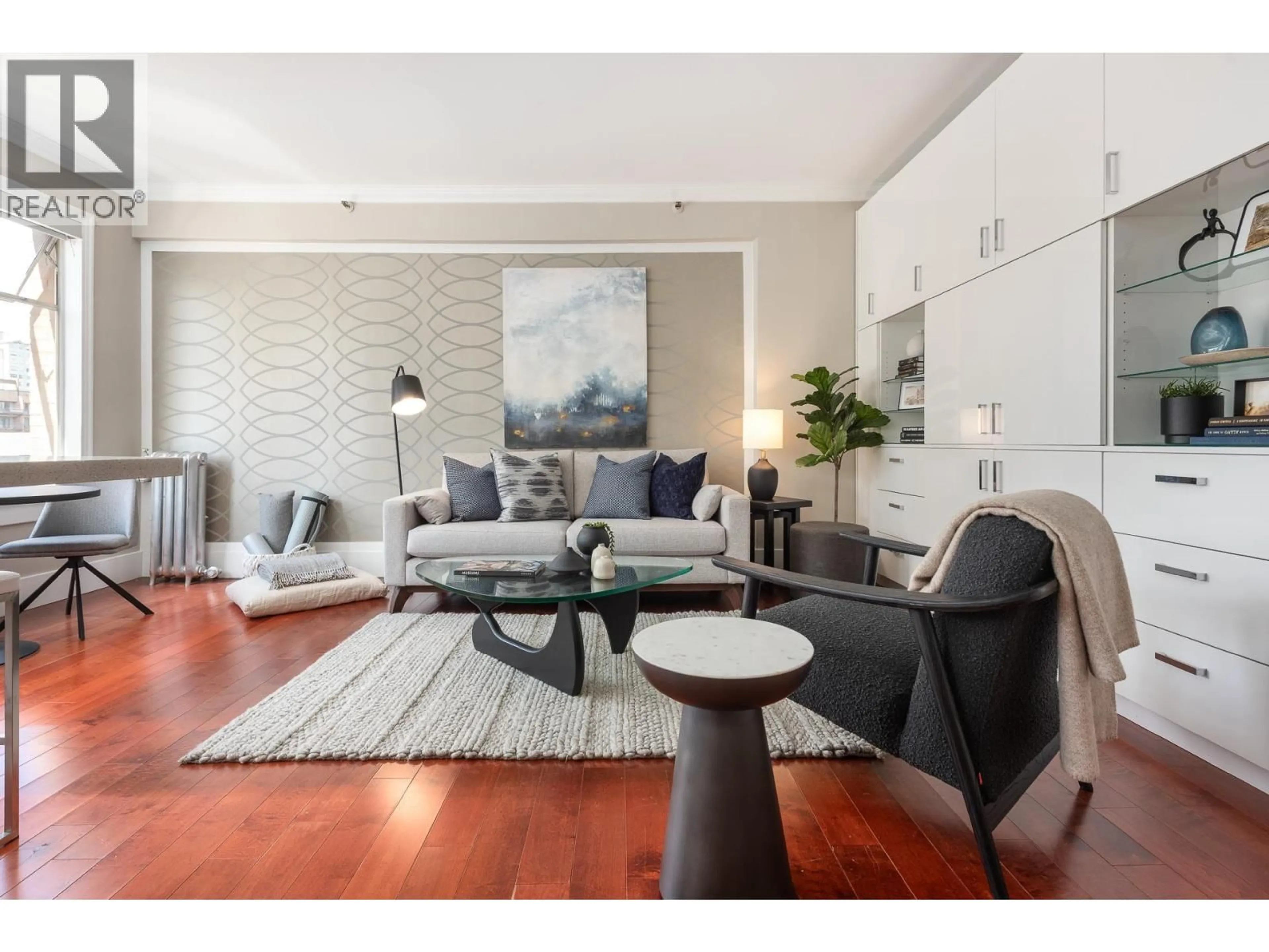 Living room with furniture, wood/laminate floor for 55 - 777 BURRARD STREET, Vancouver British Columbia V6Z1X6